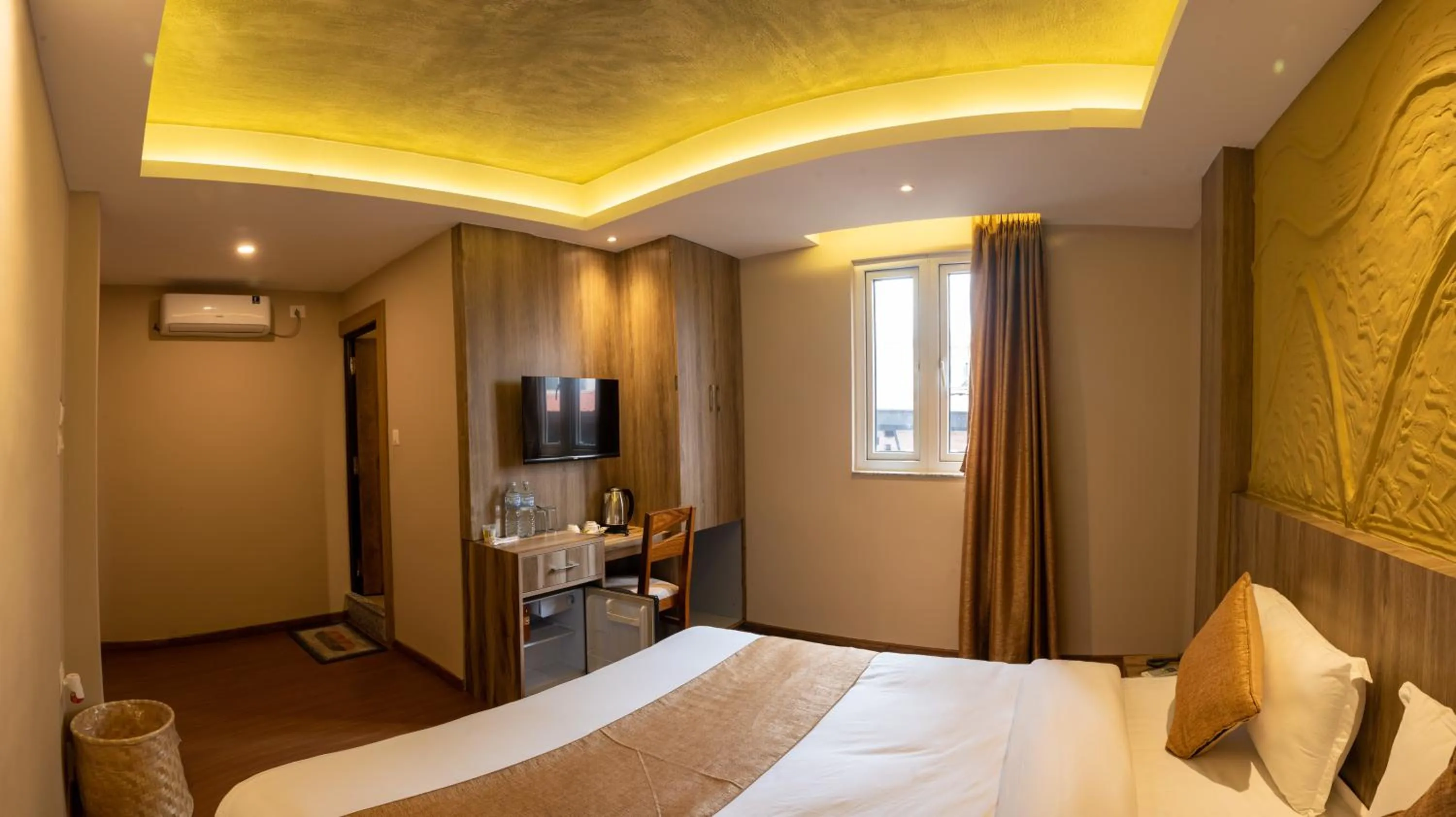 Bed in Divya Boutique Inn