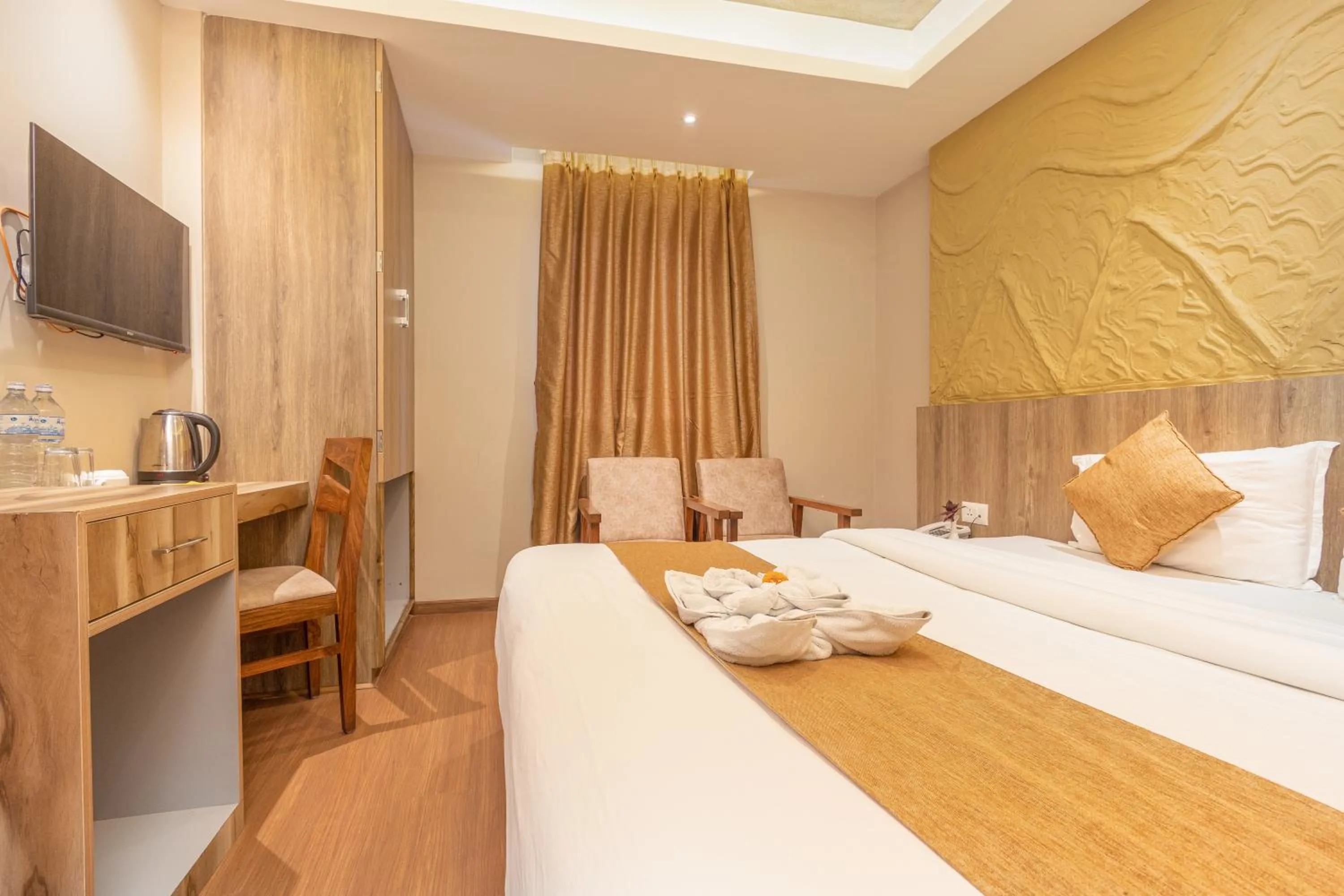 Bed in Divya Boutique Inn