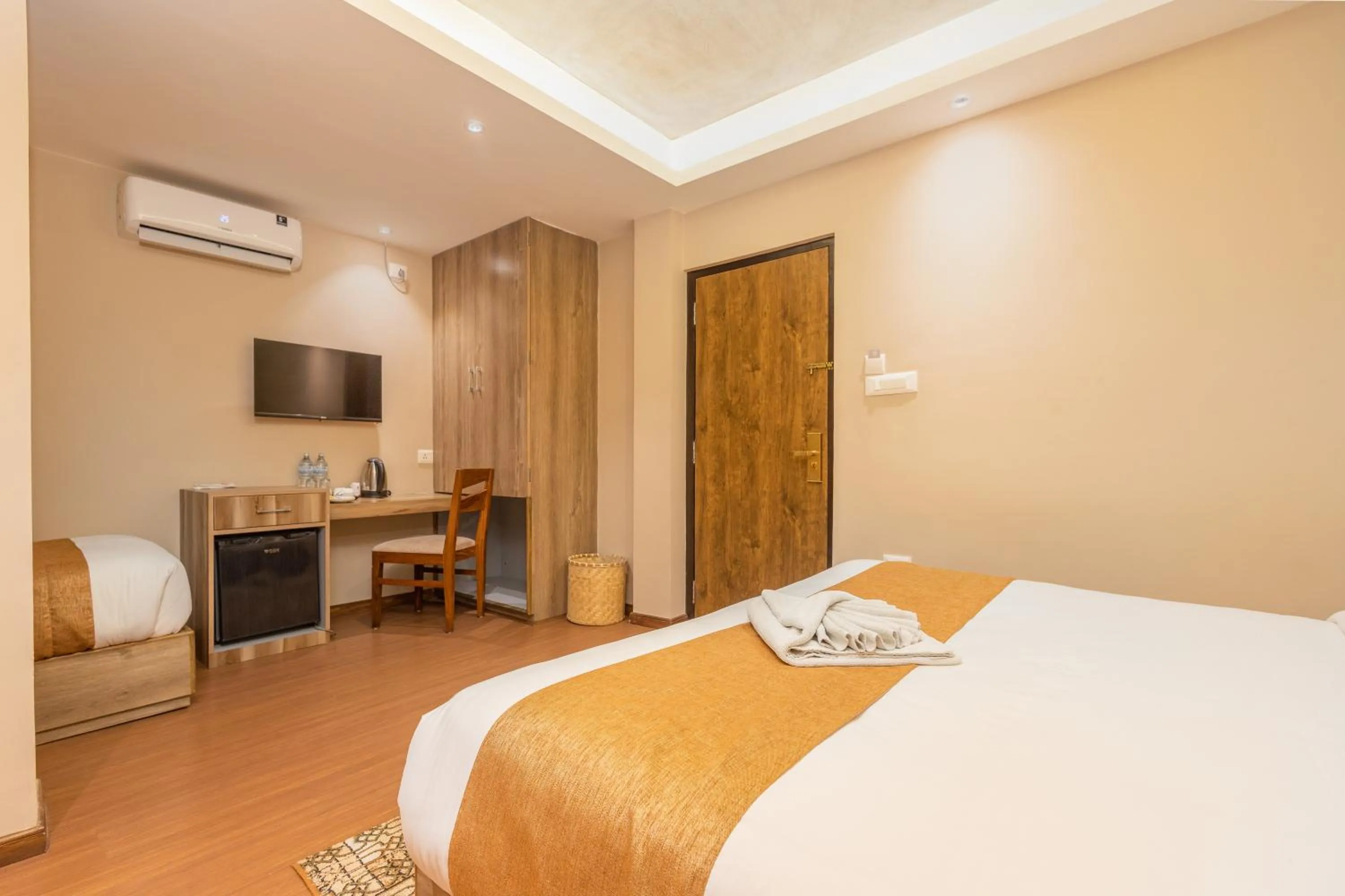 Bed in Divya Boutique Inn