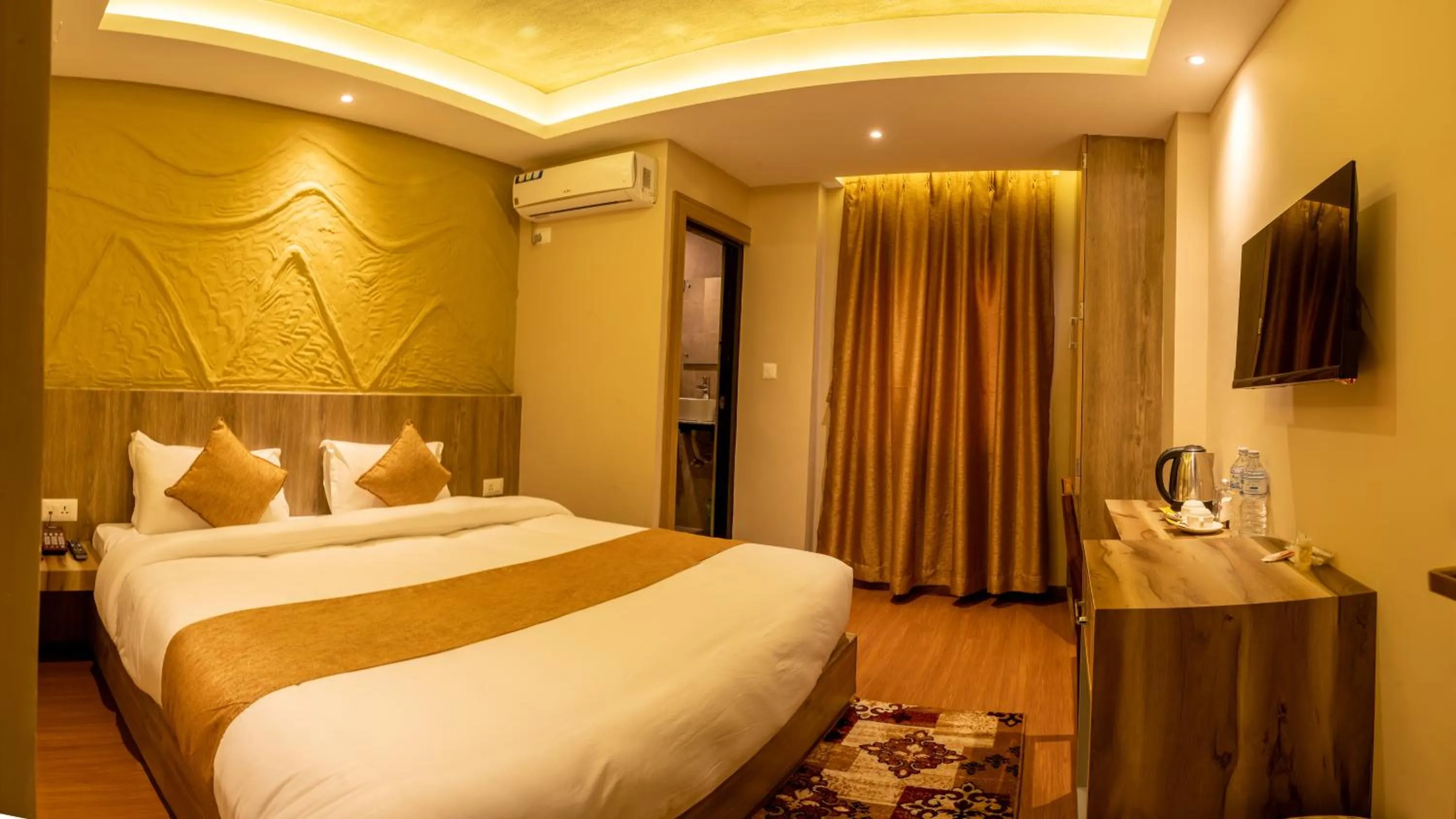 Bed in Divya Boutique Inn