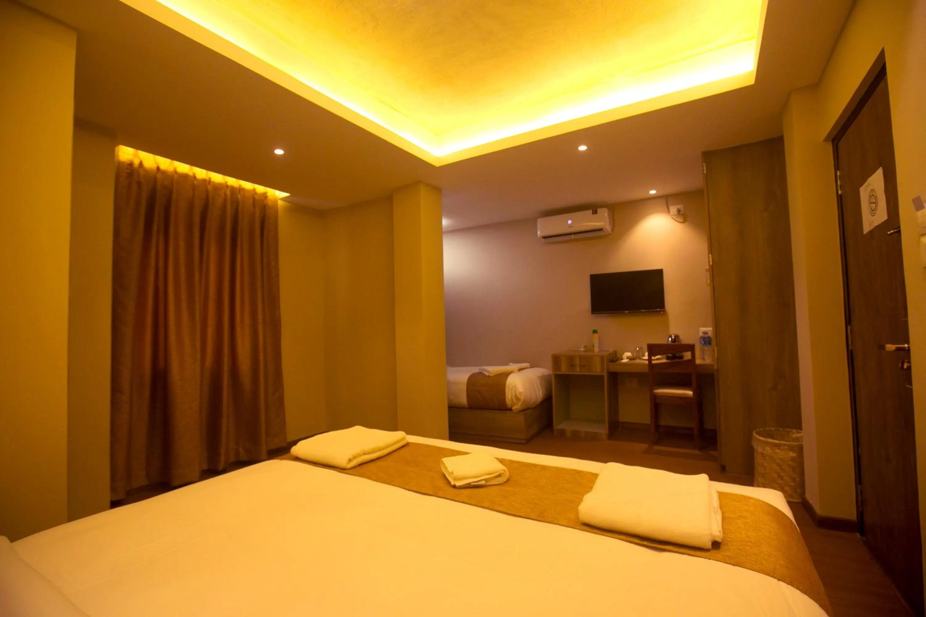 Bed in Divya Boutique Inn