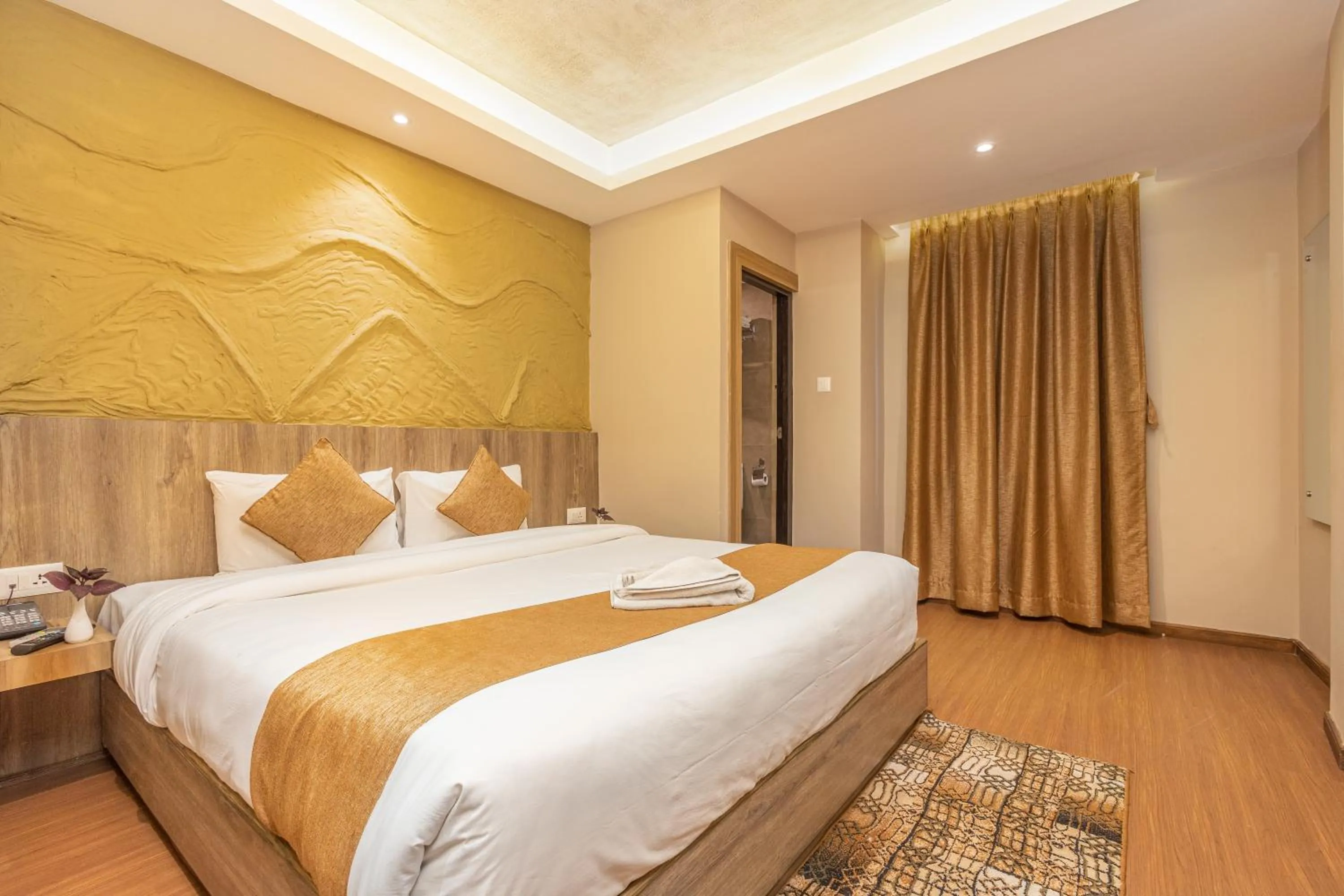 Bed in Divya Boutique Inn