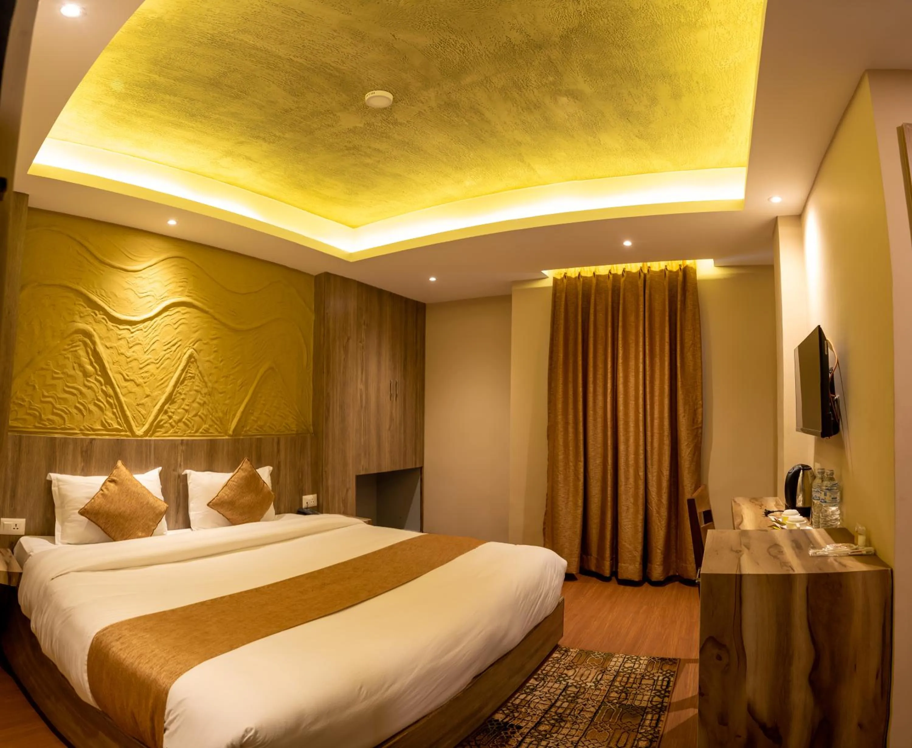 Bed in Divya Boutique Inn