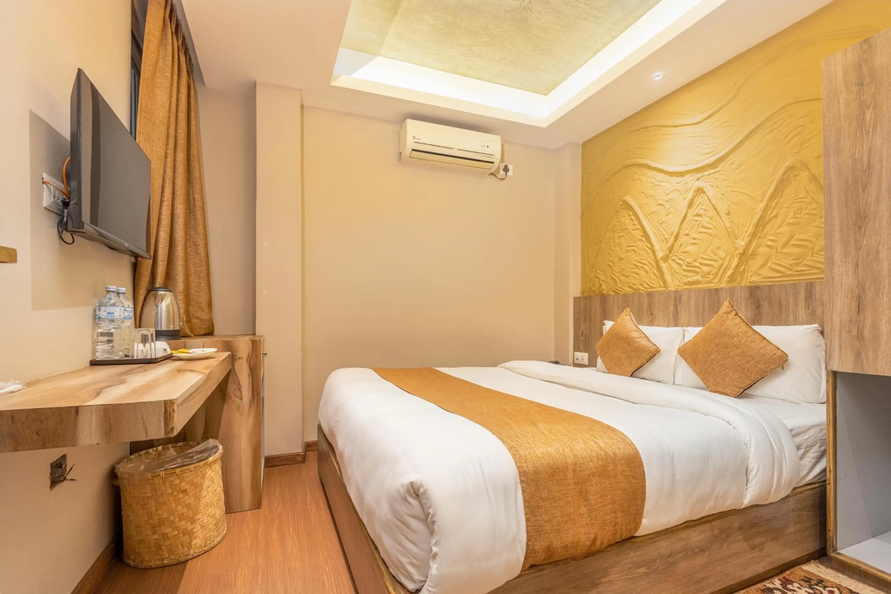 Bed in Divya Boutique Inn