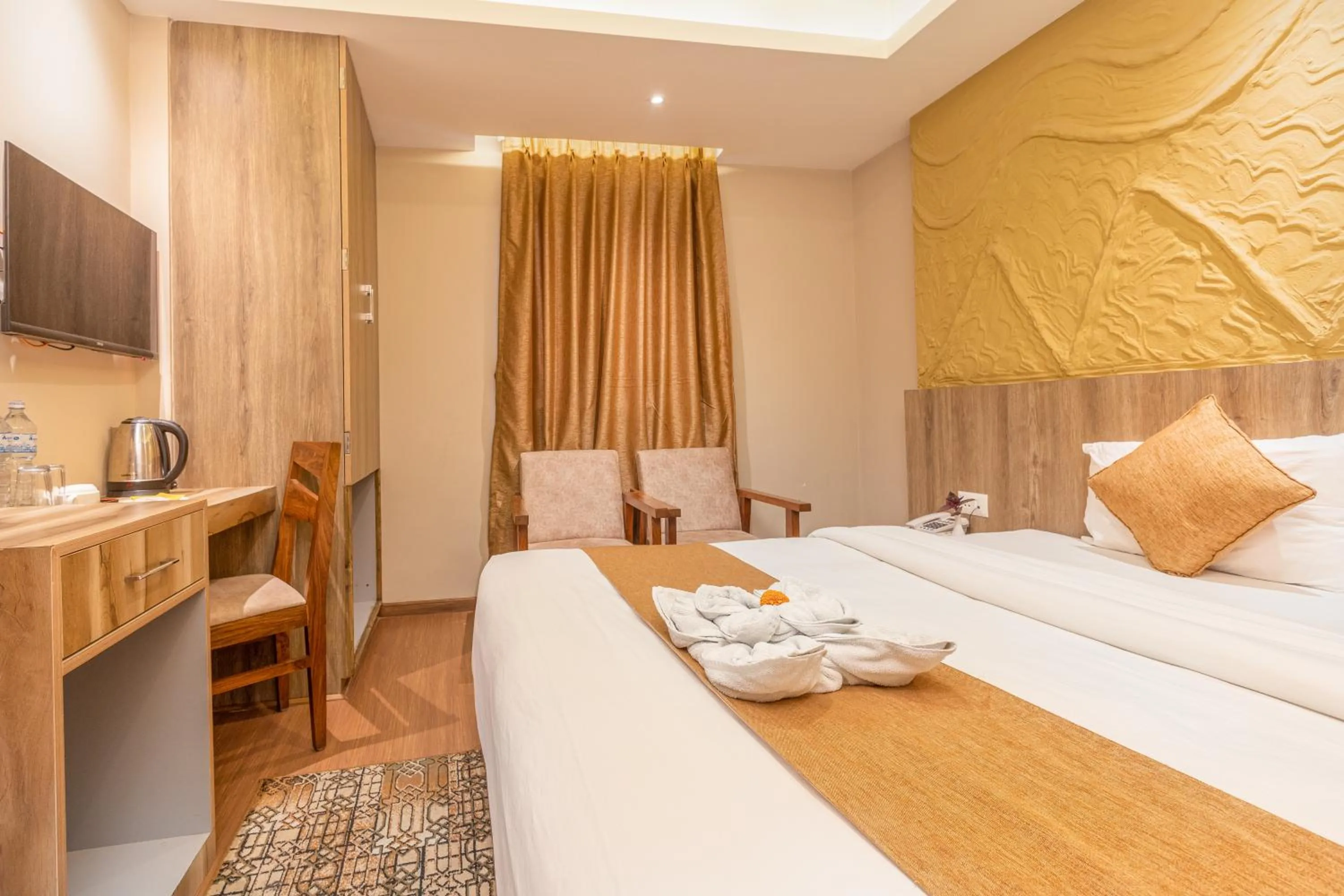 Bed in Divya Boutique Inn