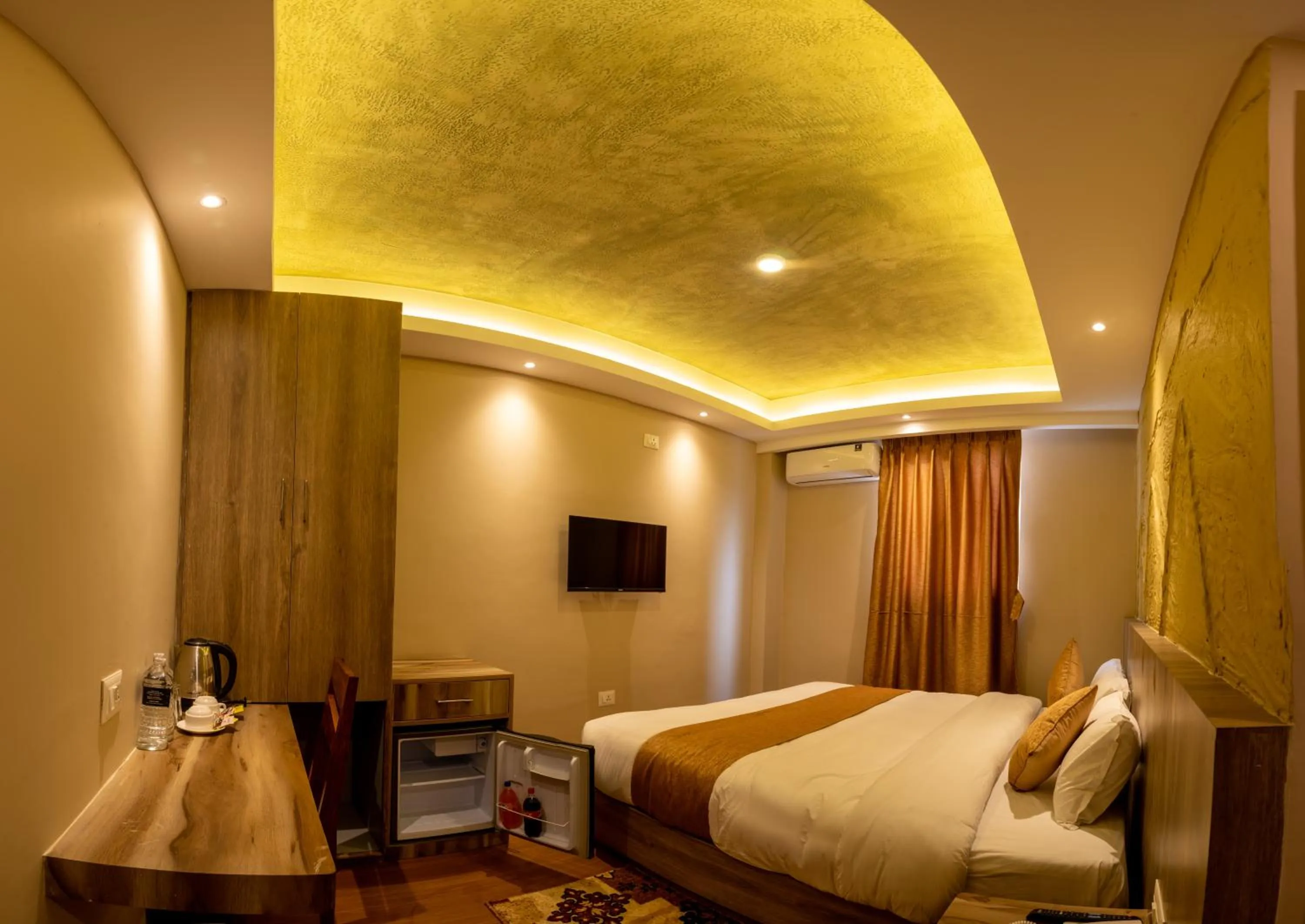 Bed in Divya Boutique Inn