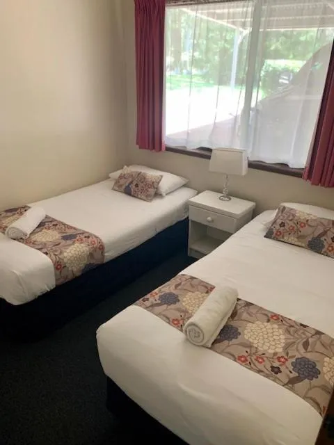 Bed in Montville Holiday Apartments