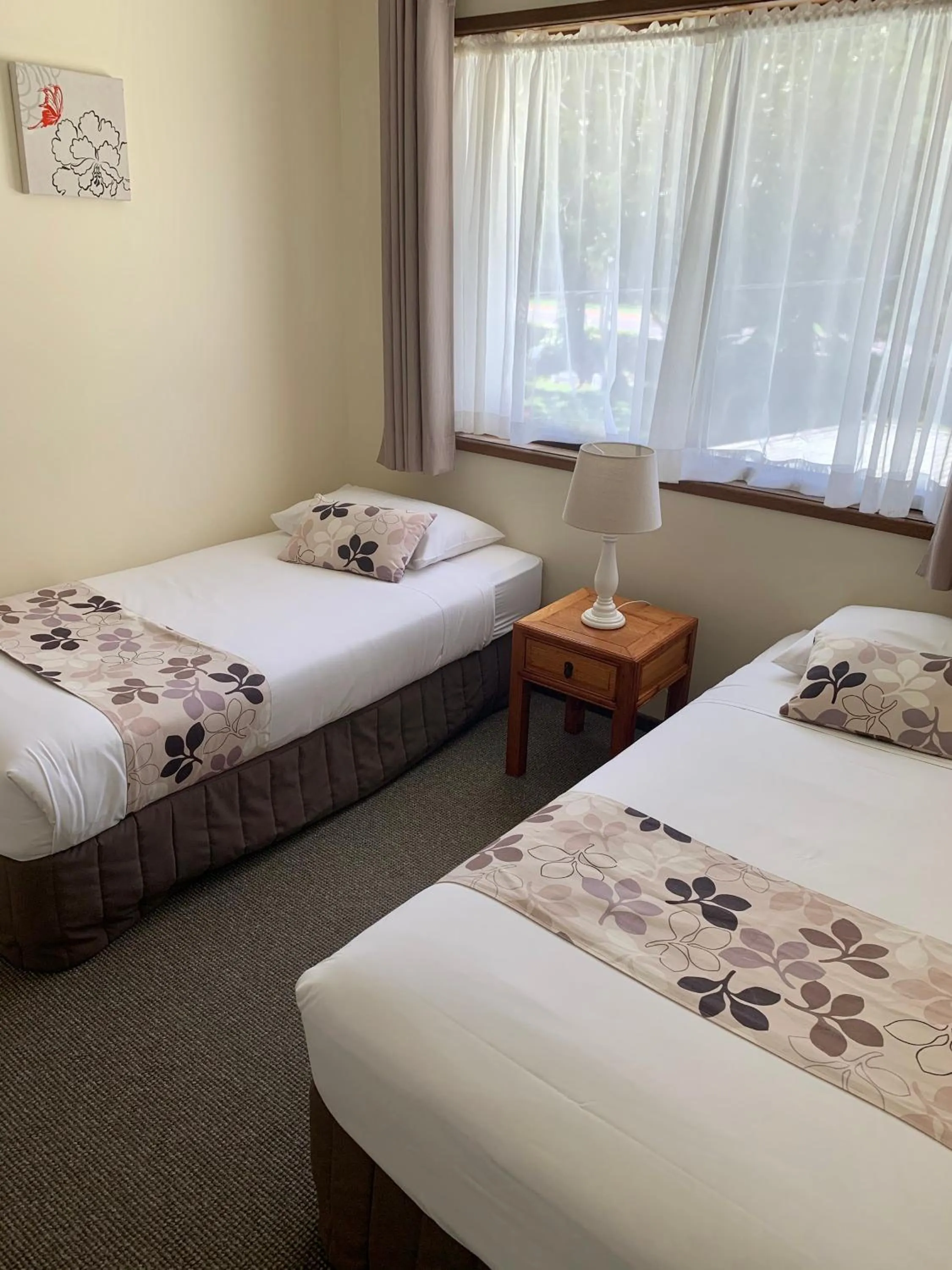 Bed in Montville Holiday Apartments