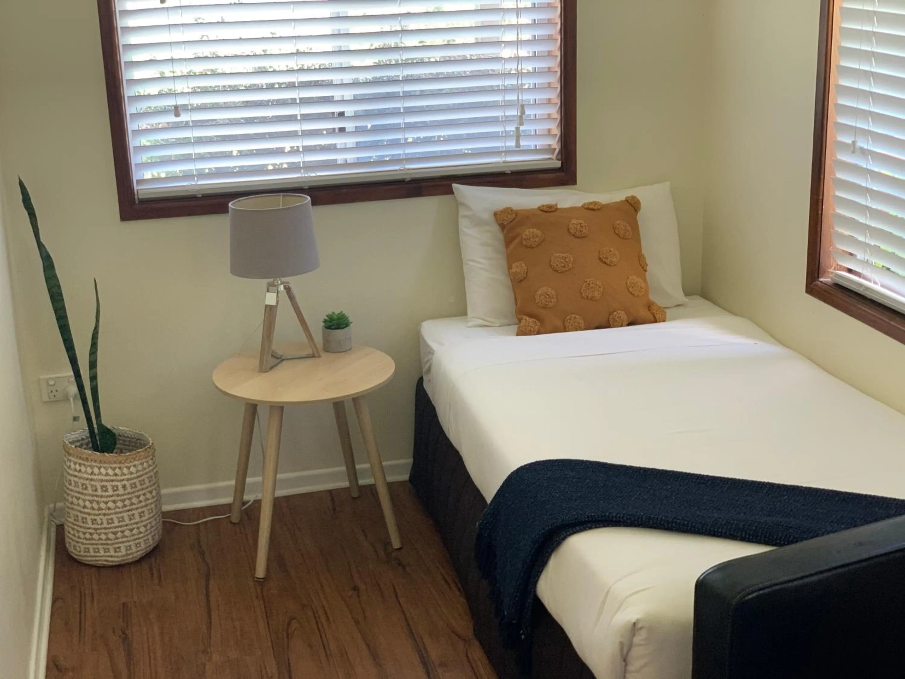 Bed in Montville Holiday Apartments