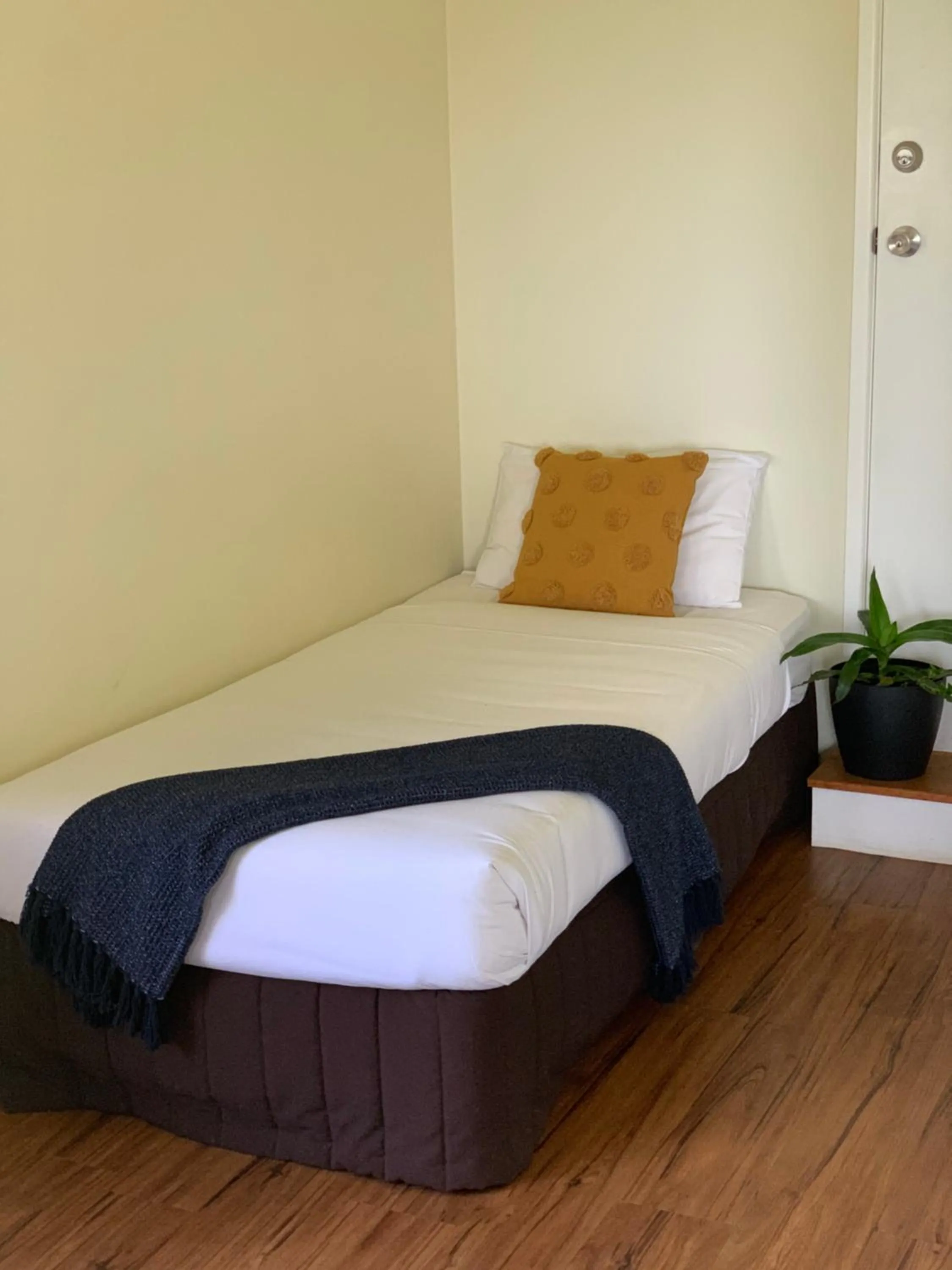 Bed in Montville Holiday Apartments
