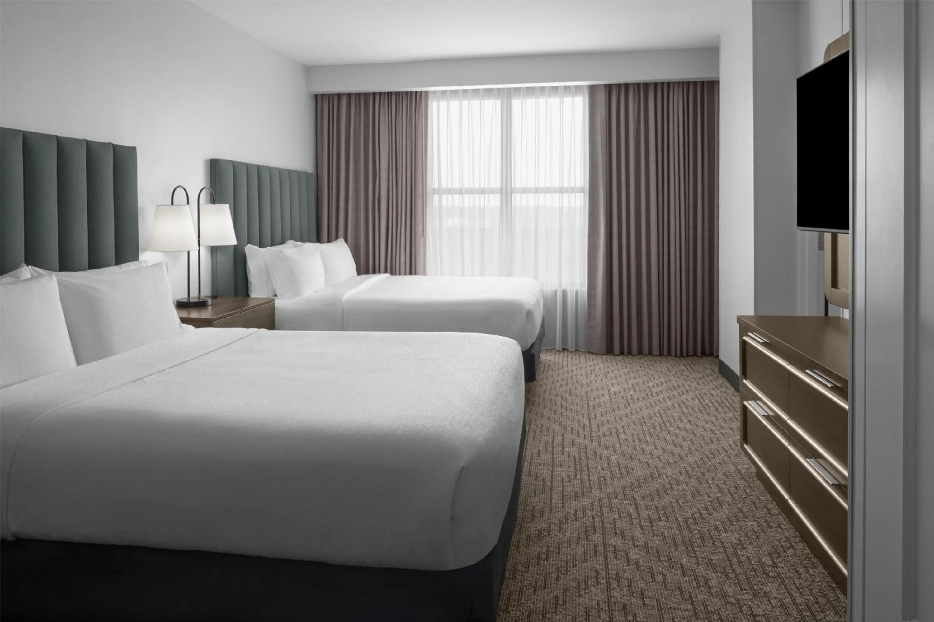 Bed in Embassy Suites by Hilton Tuscaloosa Alabama Downtown