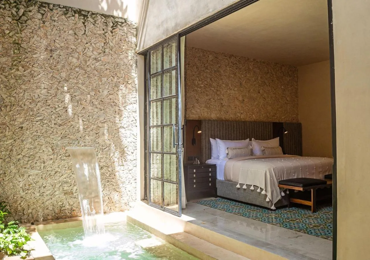 Bed in Adoro Hotel Boutique