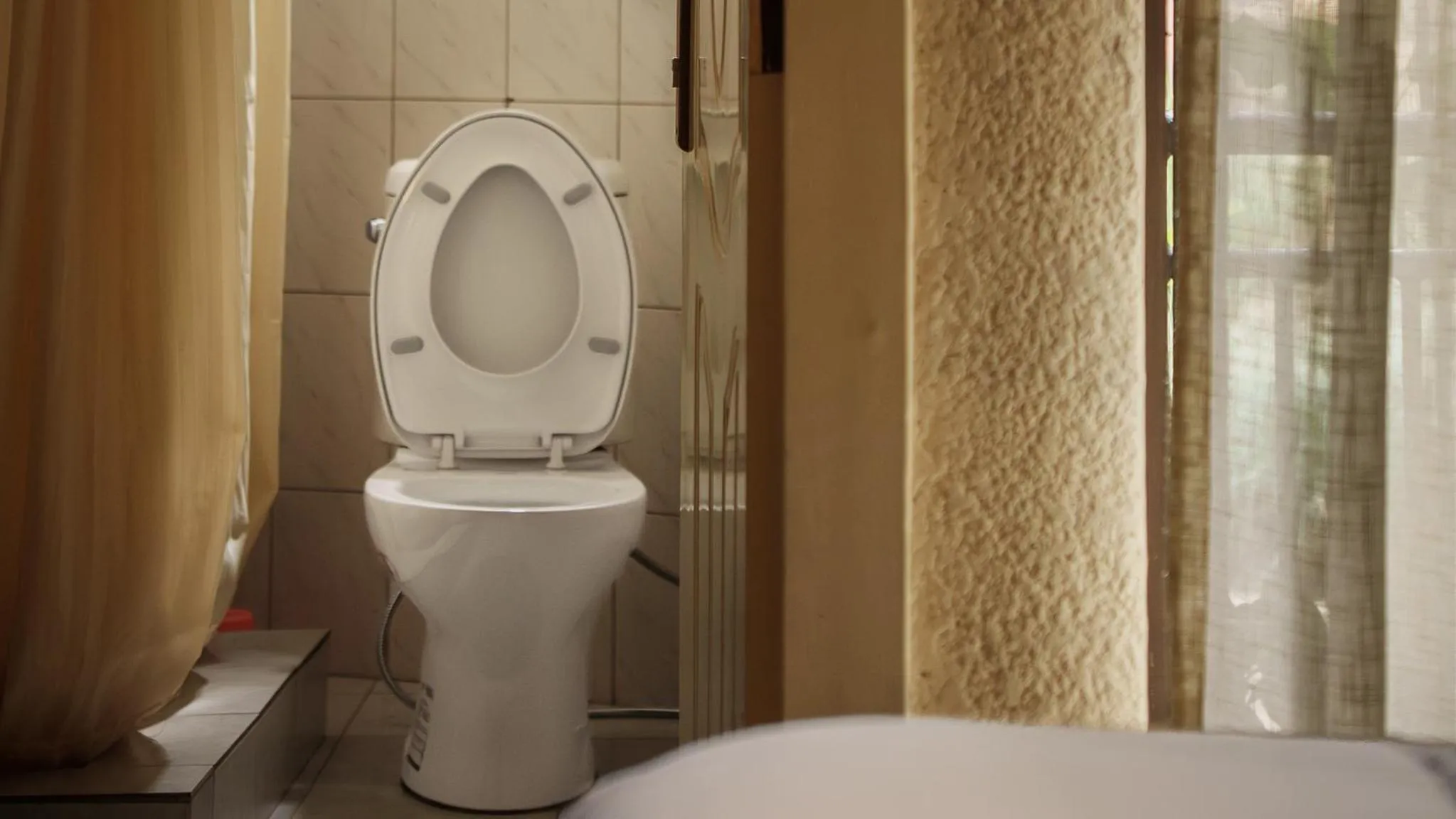 Toilet in Quality Inn Hotel Kigali