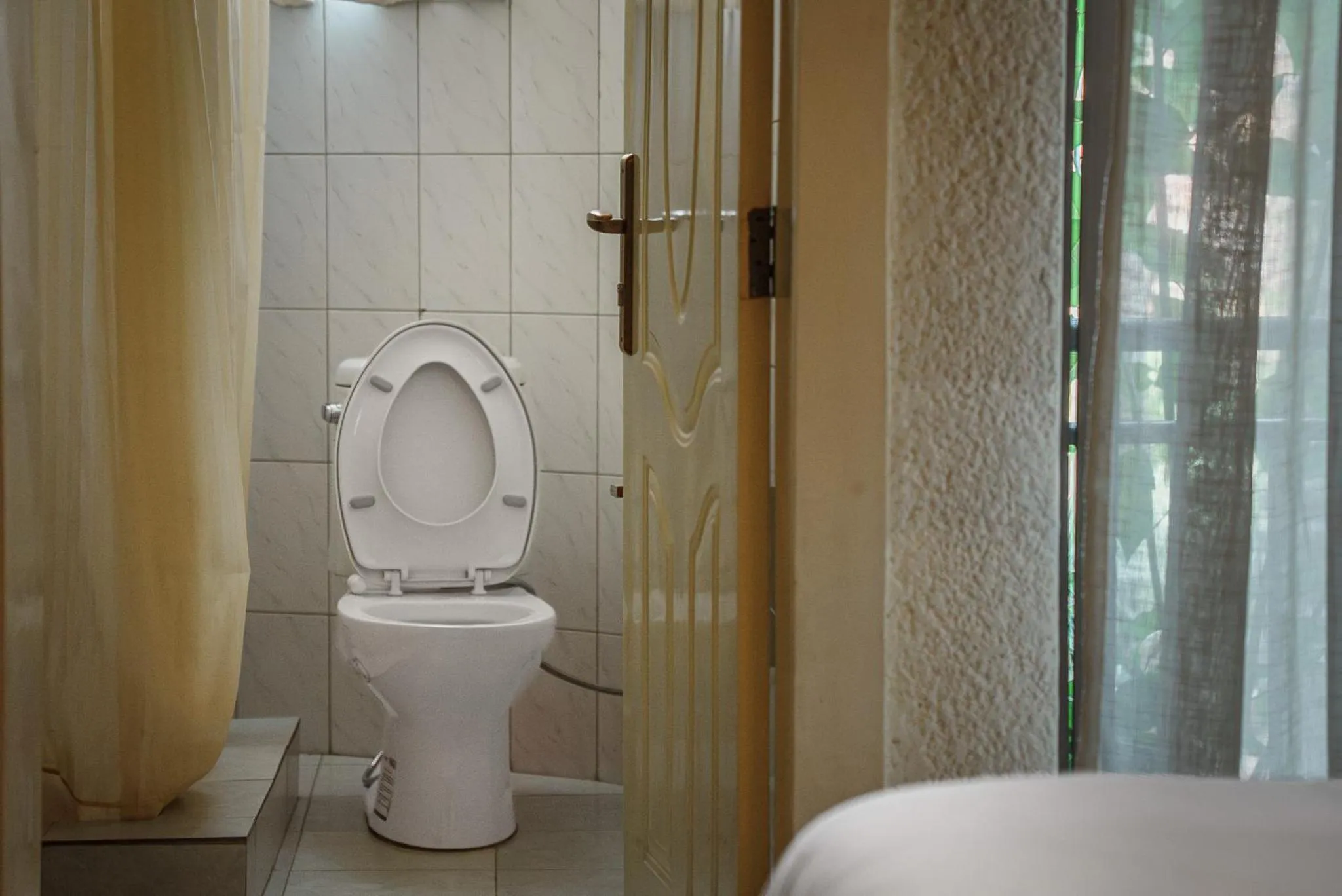 Toilet in Quality Inn Hotel Kigali