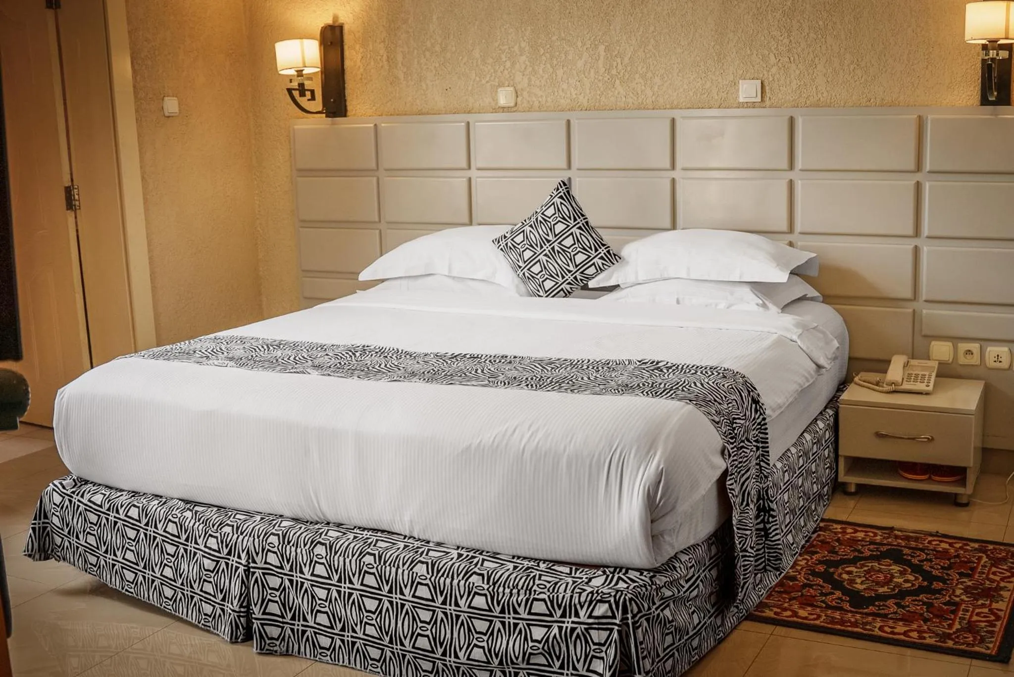 Bed in Quality Inn Hotel Kigali