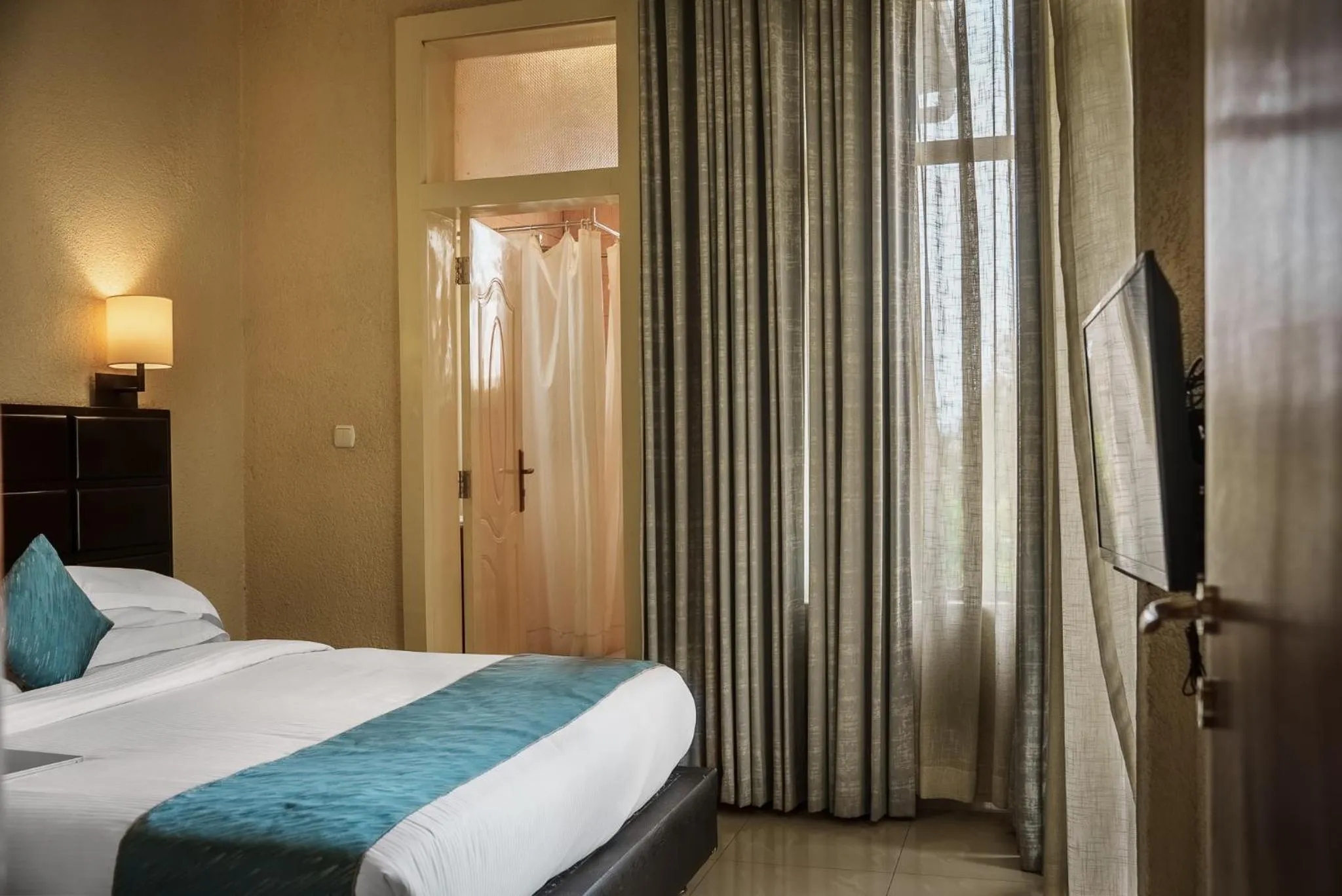 Bed in Quality Inn Hotel Kigali