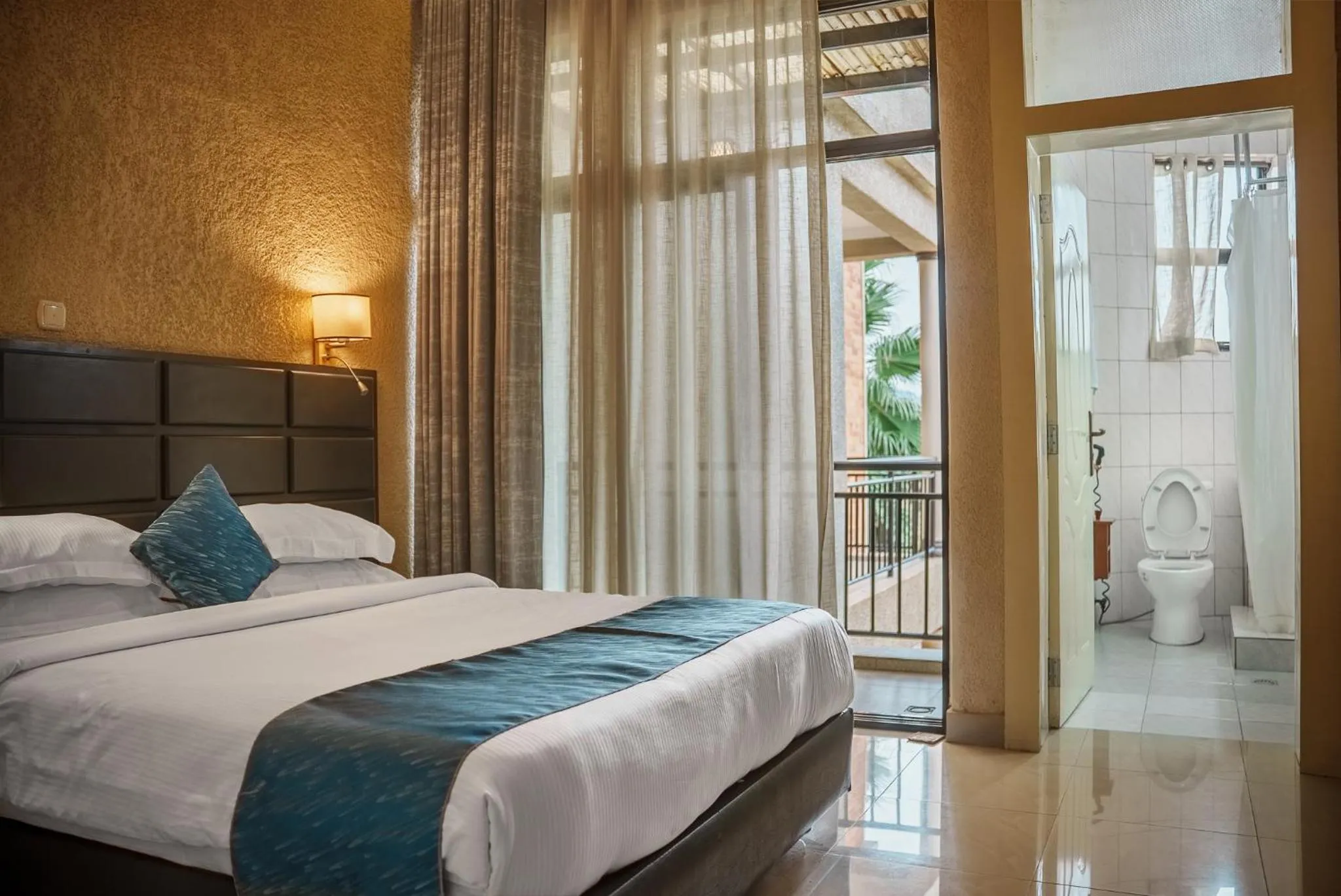 Bed in Quality Inn Hotel Kigali