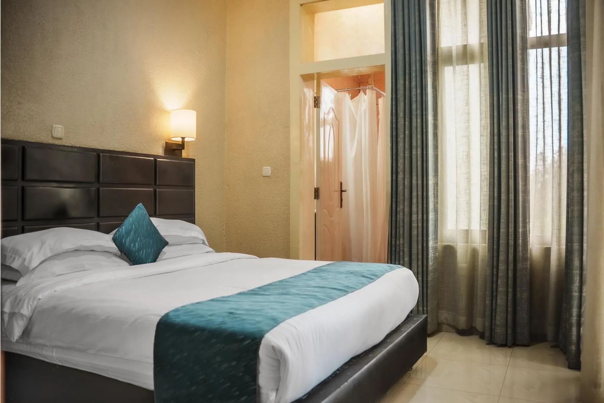 Bed in Quality Inn Hotel Kigali