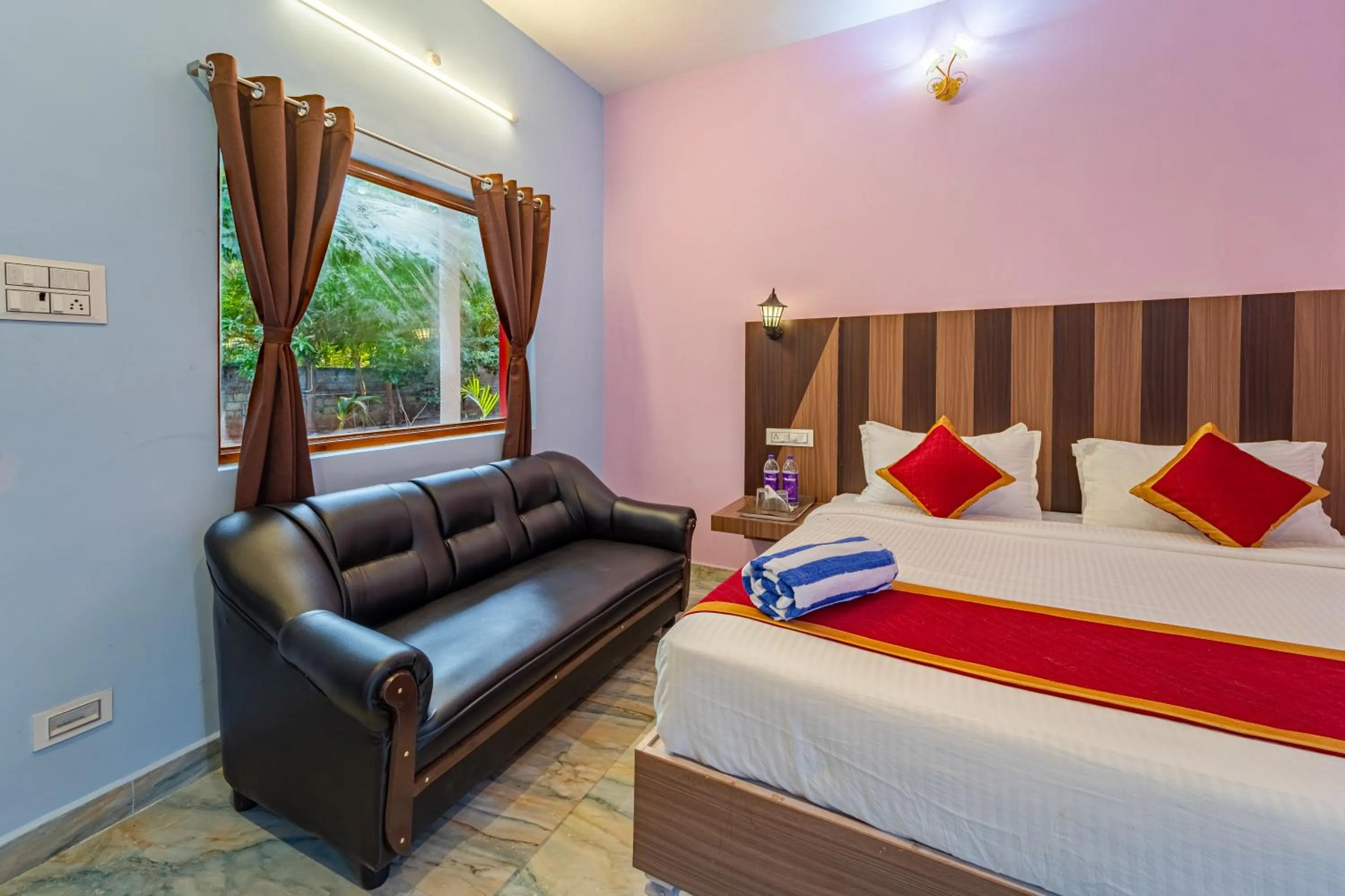 Bed in Hotel De Jardin Pondicherry with Swimming Pool