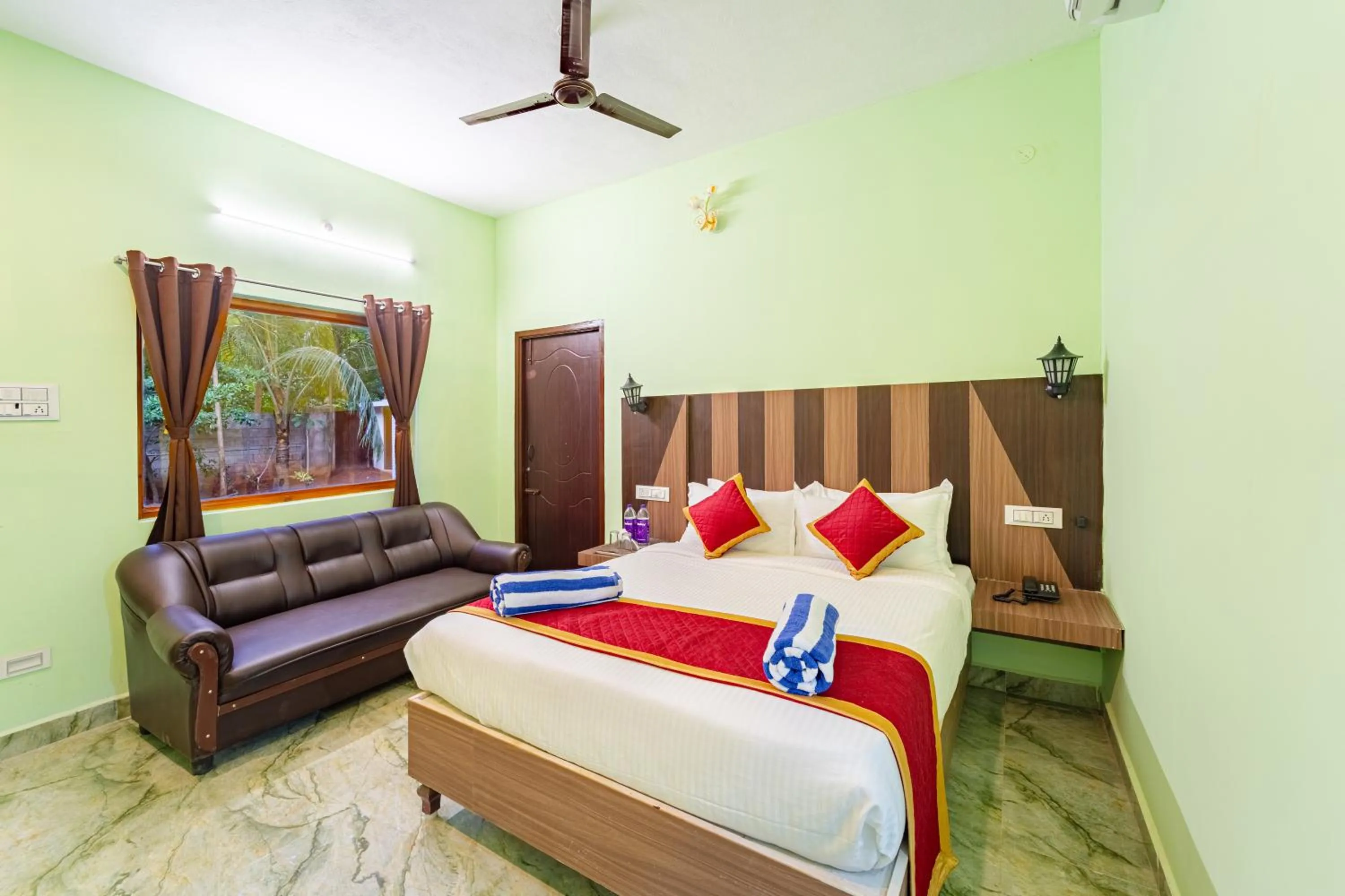 Bed in Hotel De Jardin Pondicherry with Swimming Pool