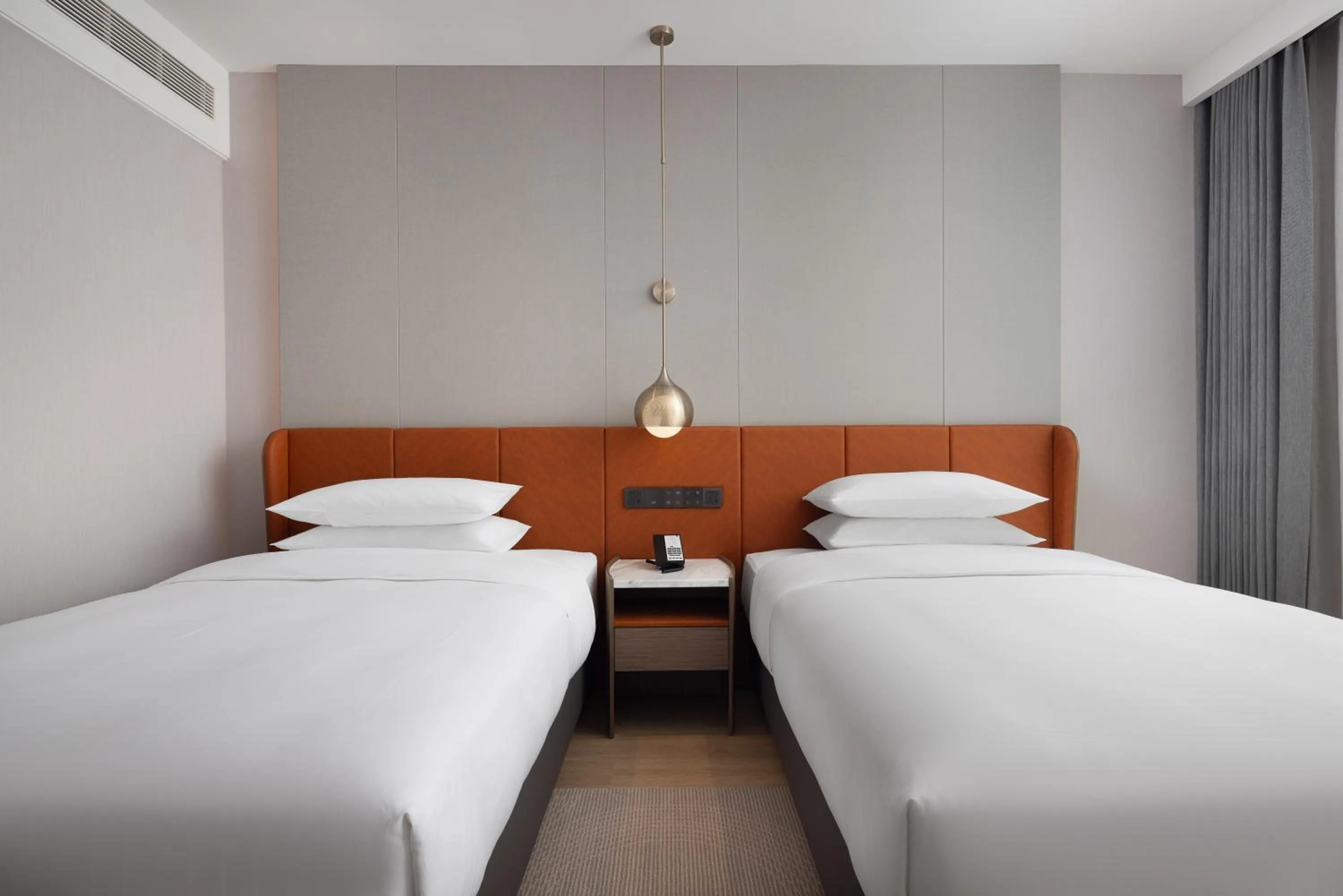 Bed in Home2 Suite by Hilton Jingdezhen Changnan