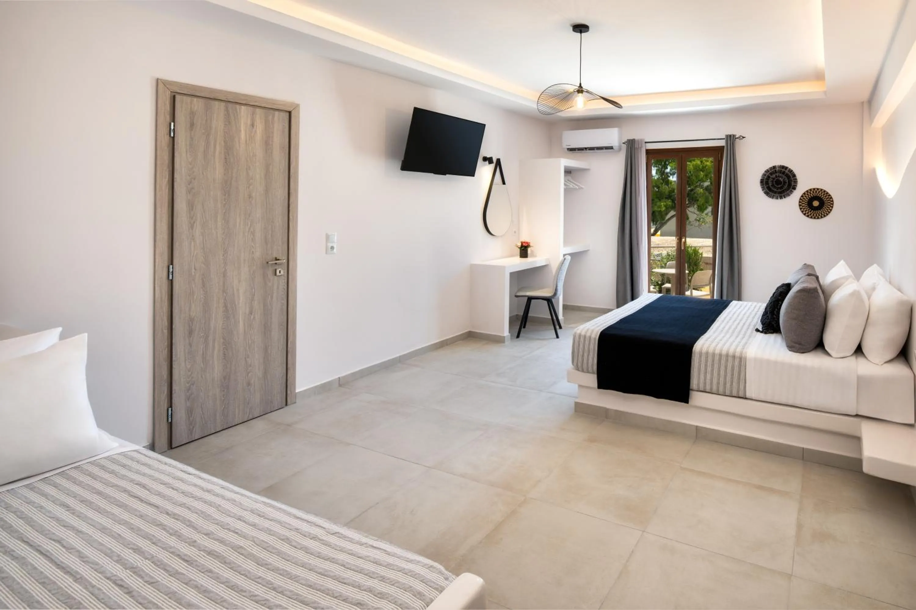 Bed in Santorinn Suites Fira