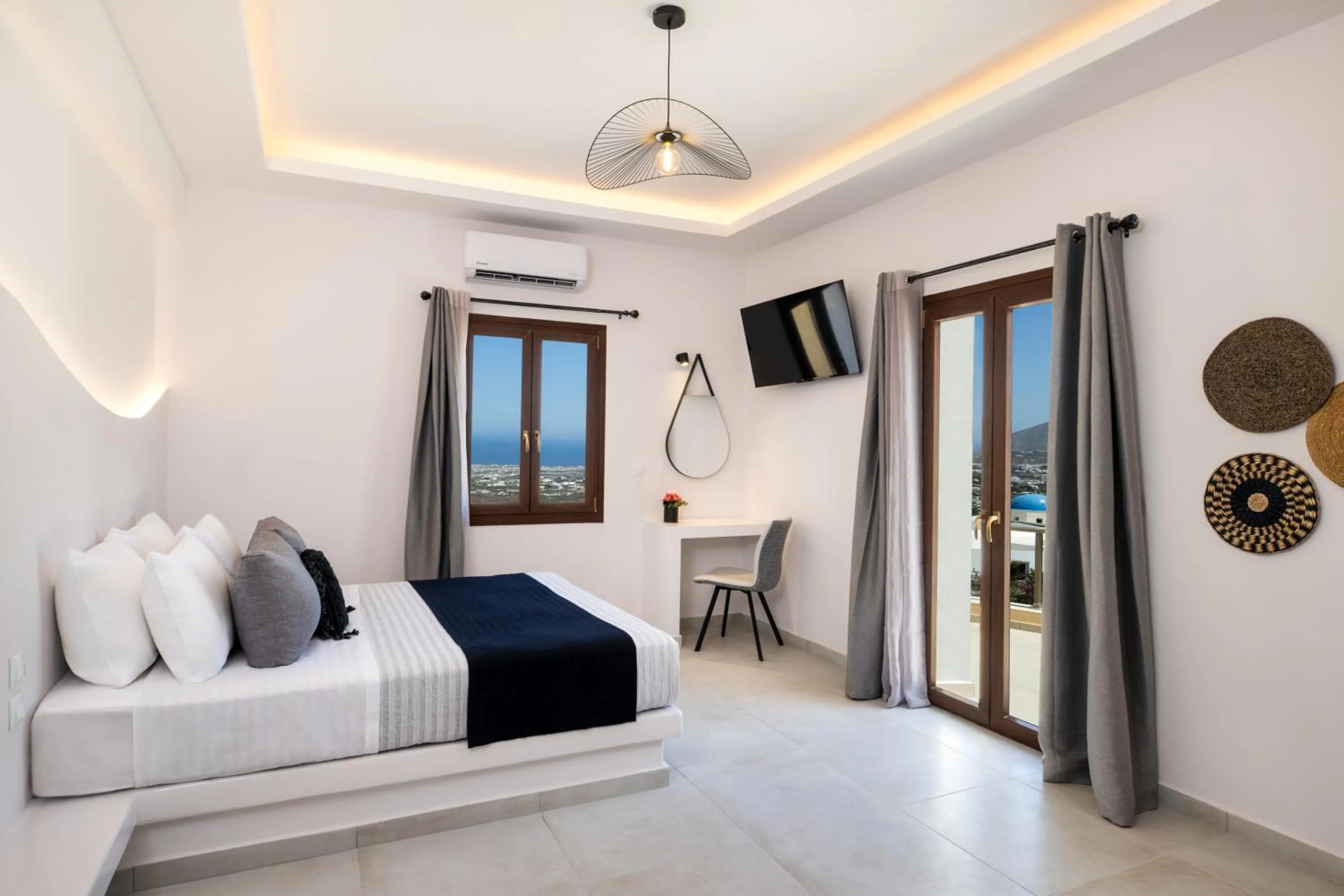 Bed in Santorinn Suites Fira