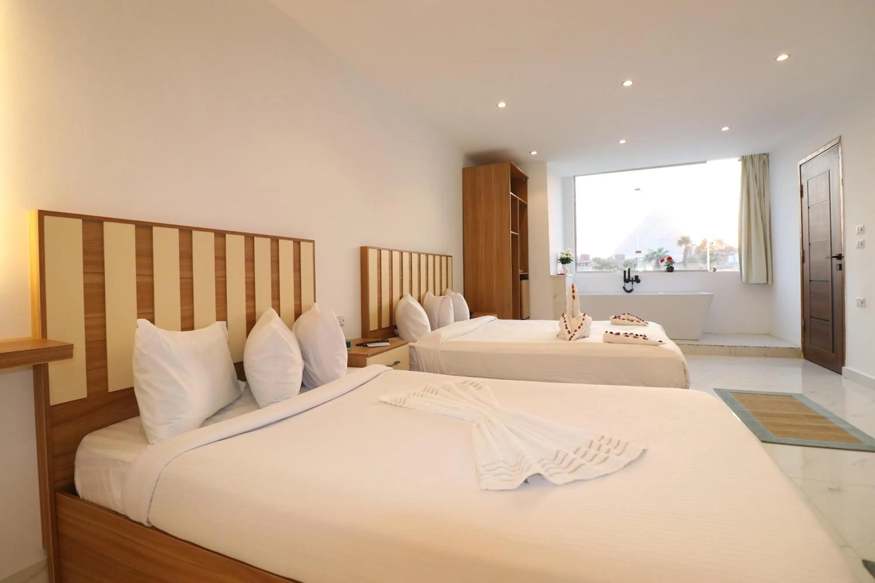 Bed in West Pyramids Hotel