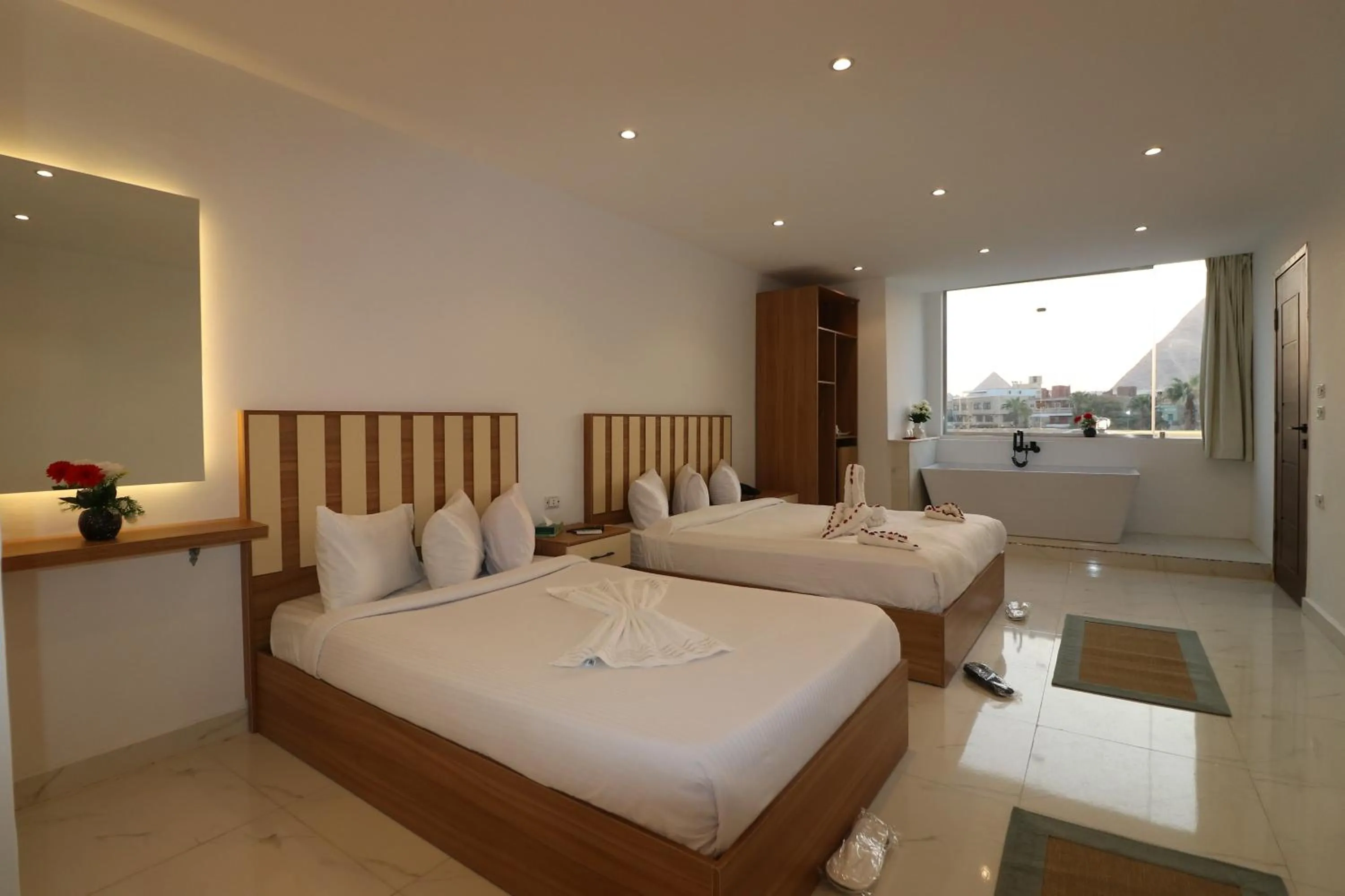 Bed in West Pyramids Hotel