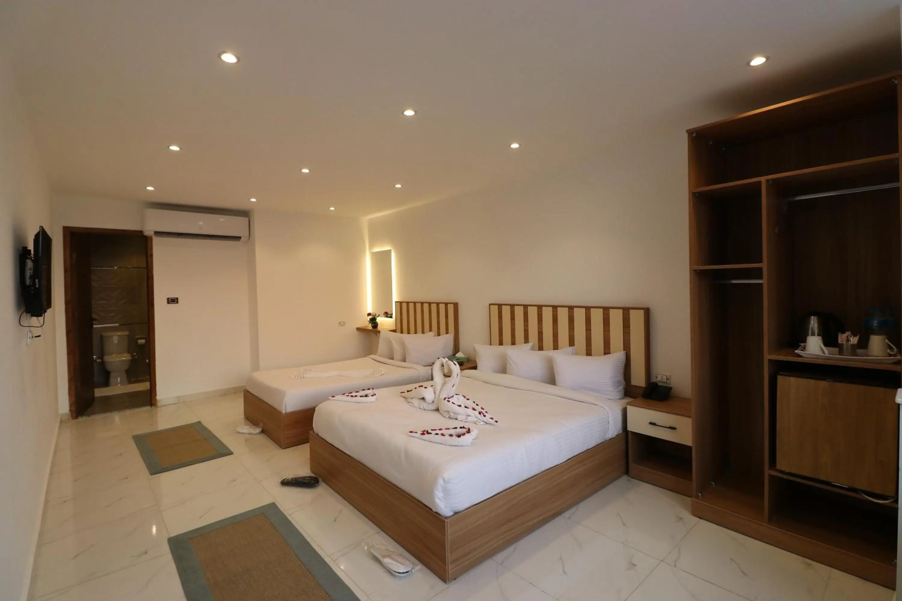 Bed in West Pyramids Hotel