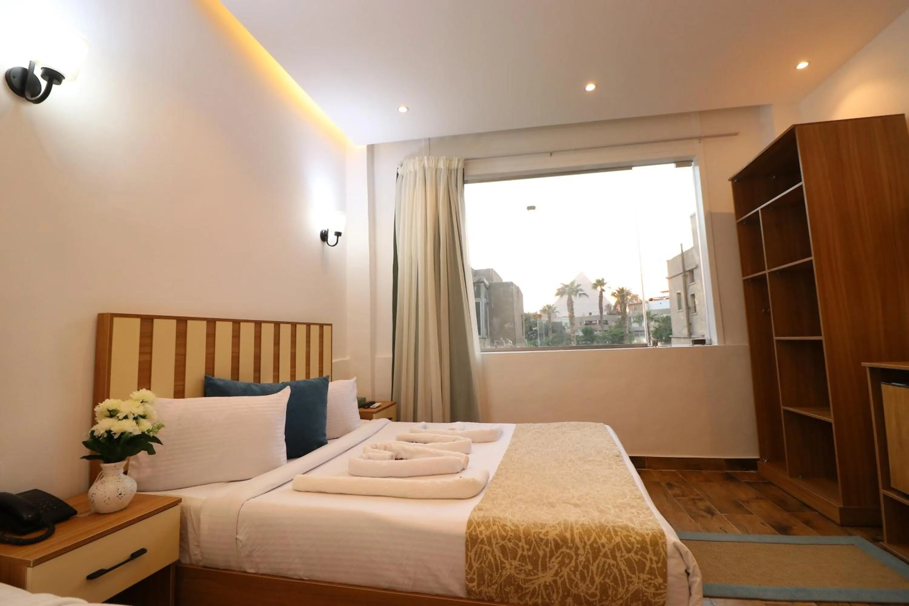 Bed in West Pyramids Hotel