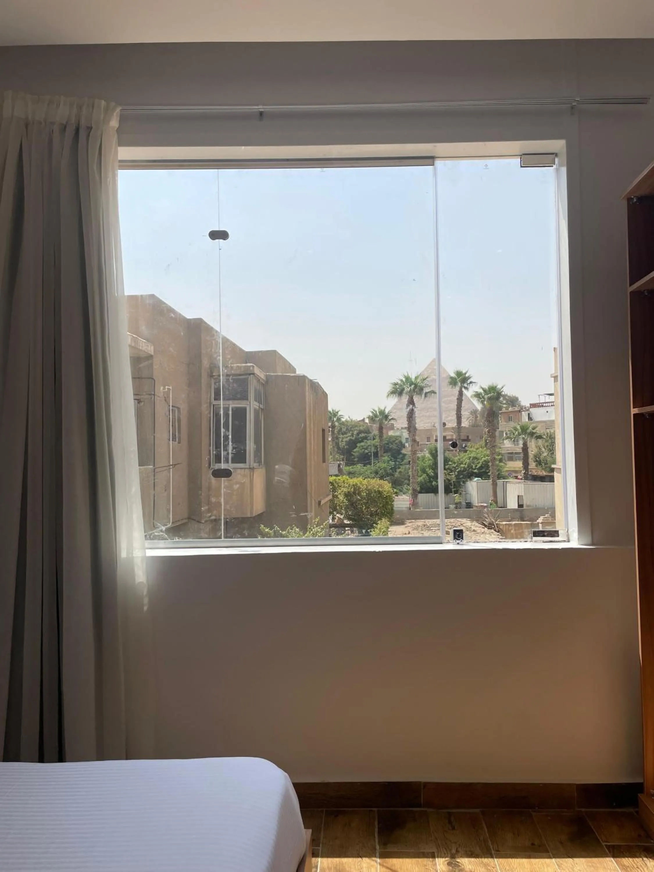Bed in West Pyramids Hotel