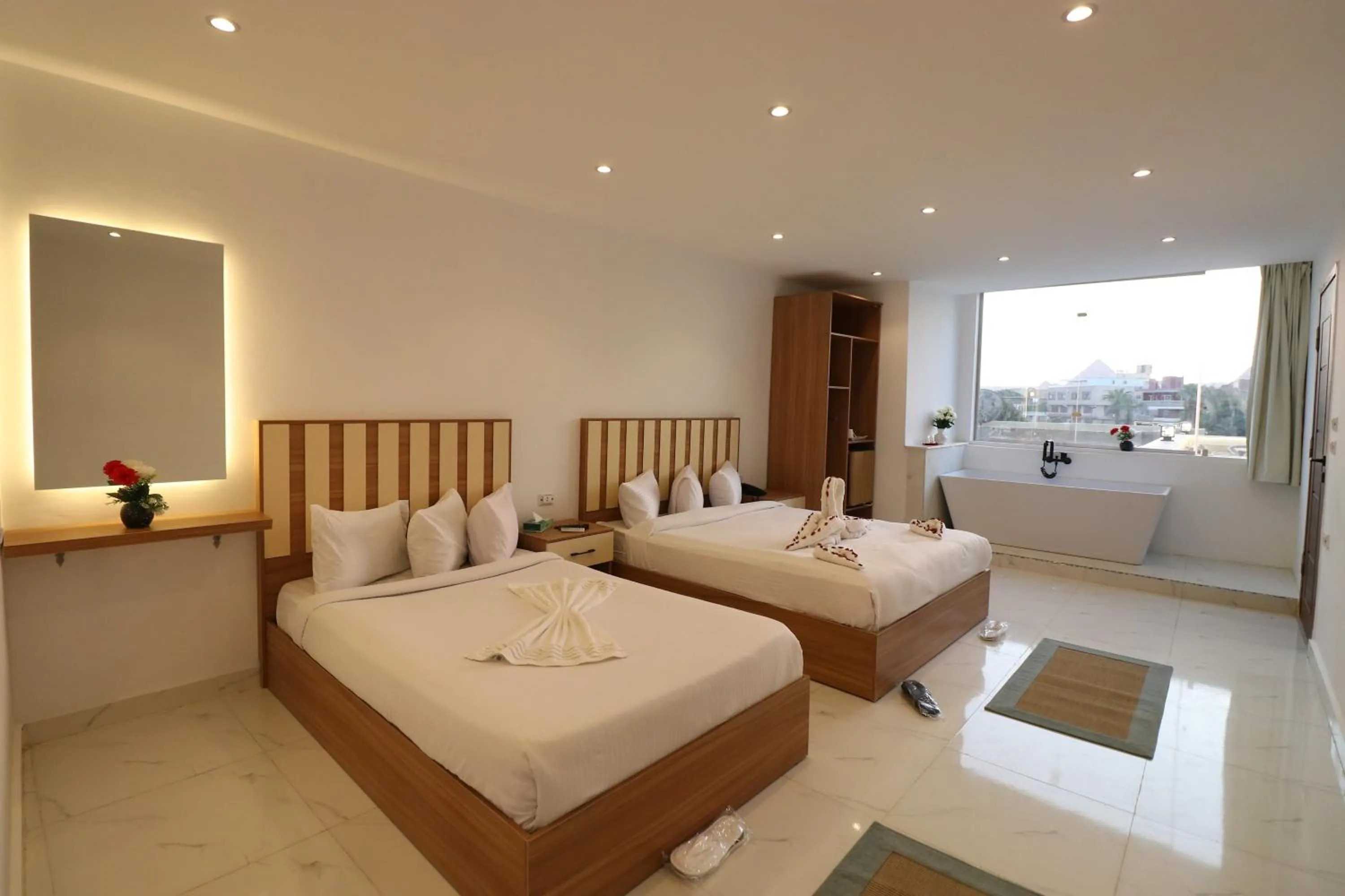 Bed in West Pyramids Hotel