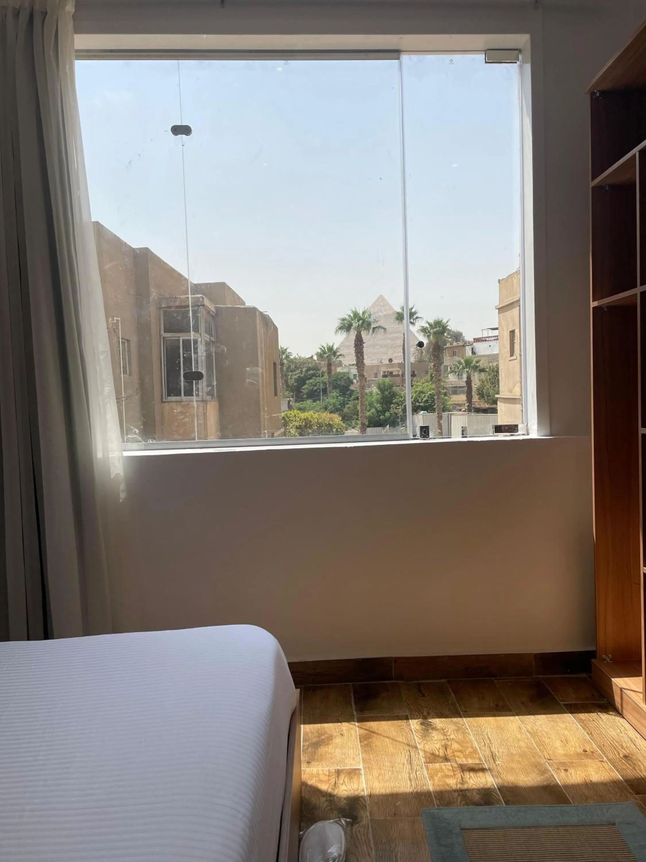 Bed in West Pyramids Hotel