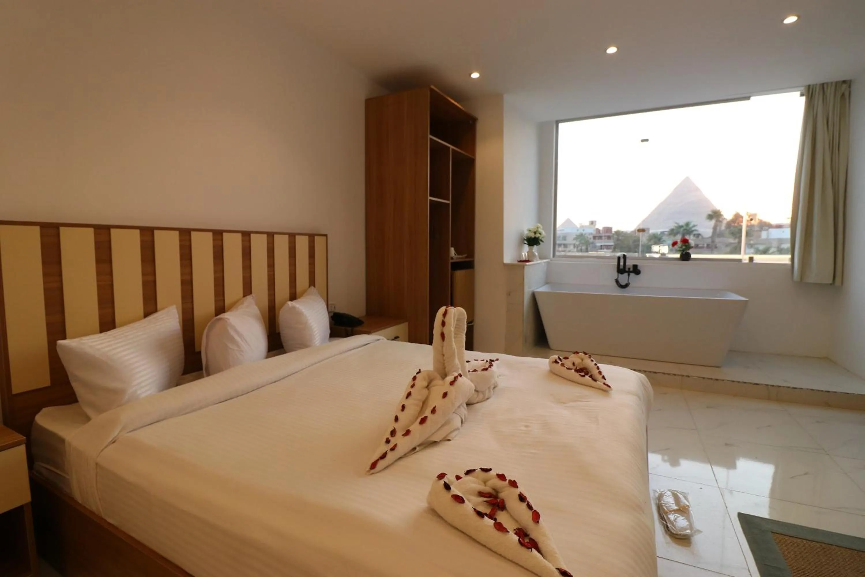 Bed in West Pyramids Hotel