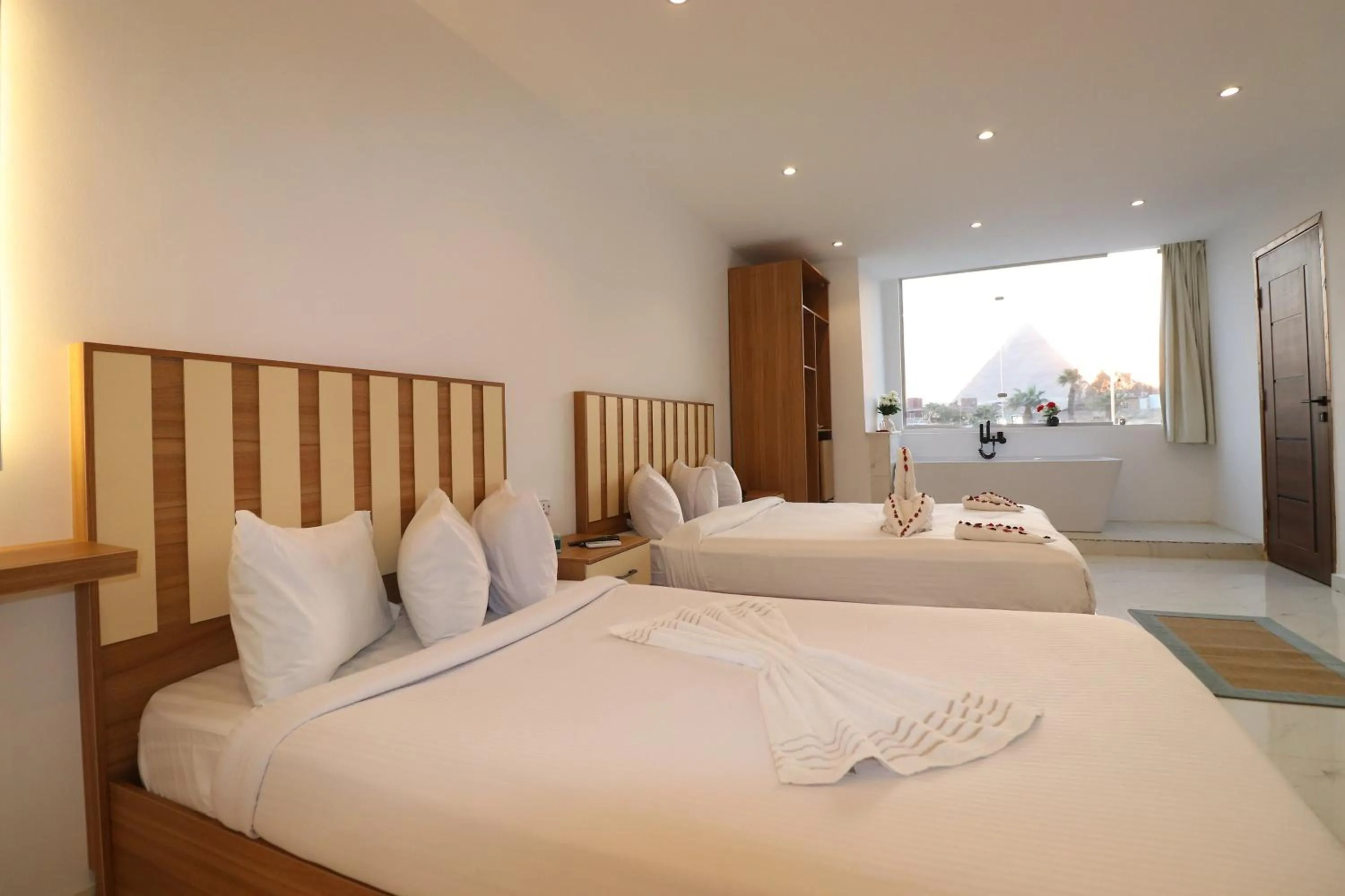 Bed in West Pyramids Hotel