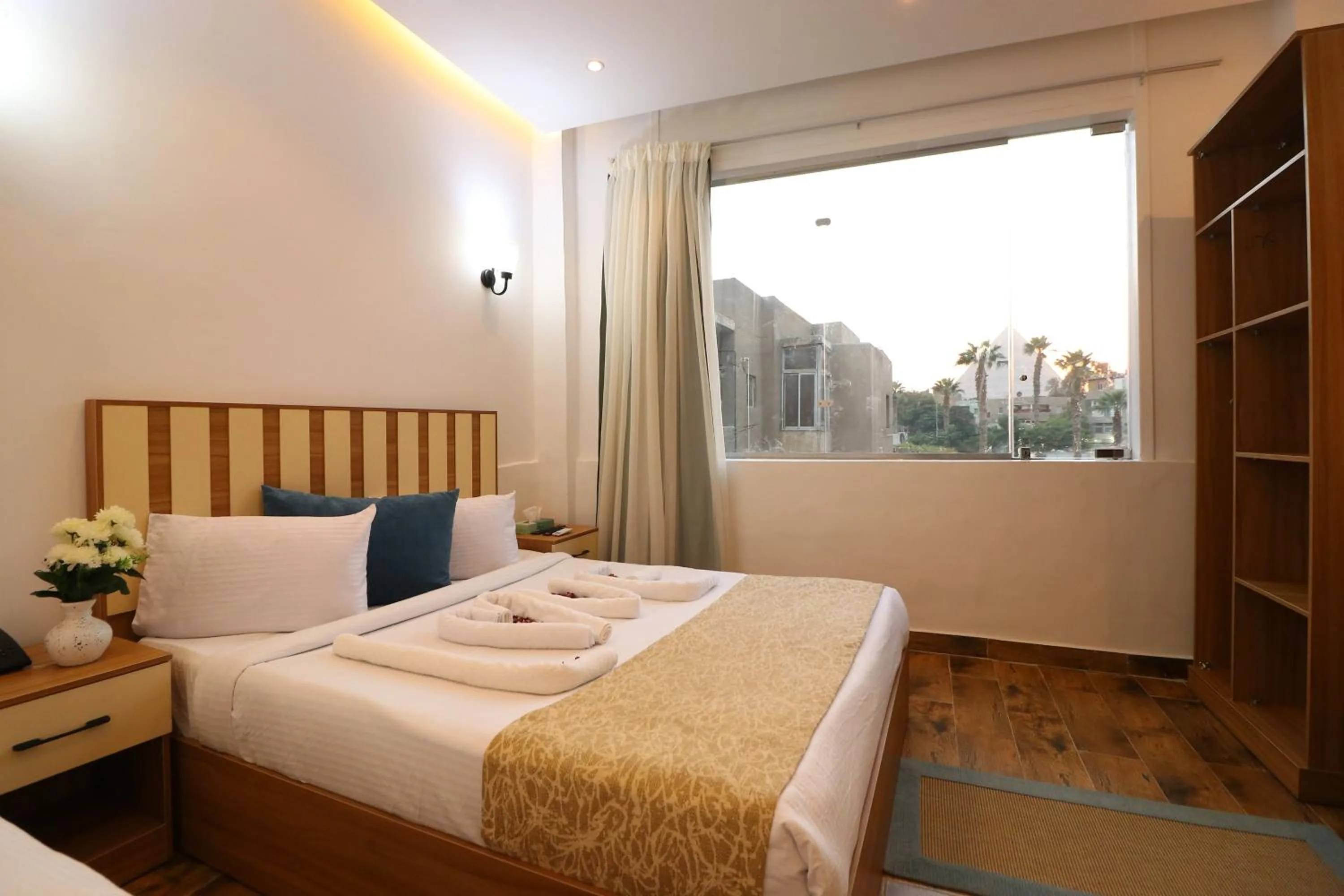 Bed in West Pyramids Hotel