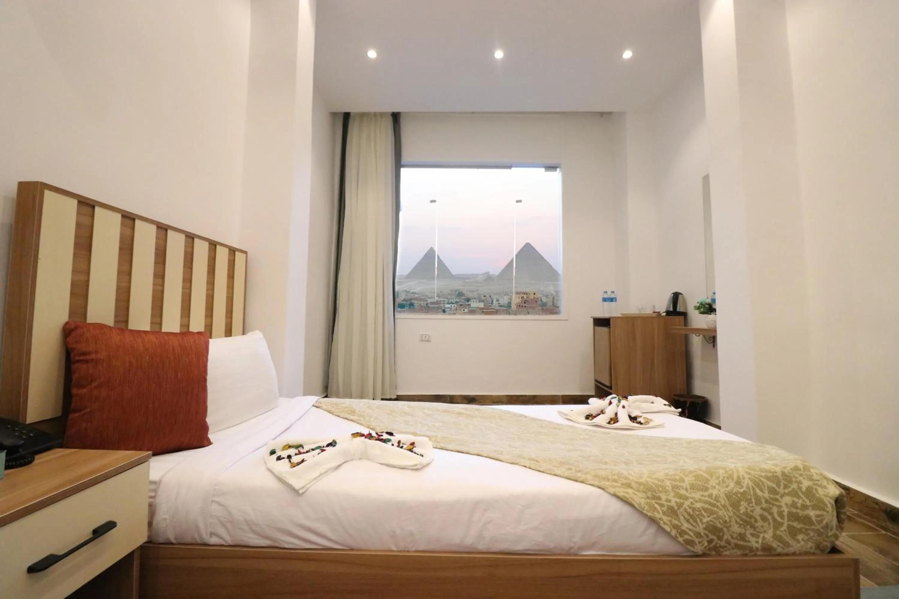 Bed in West Pyramids Hotel