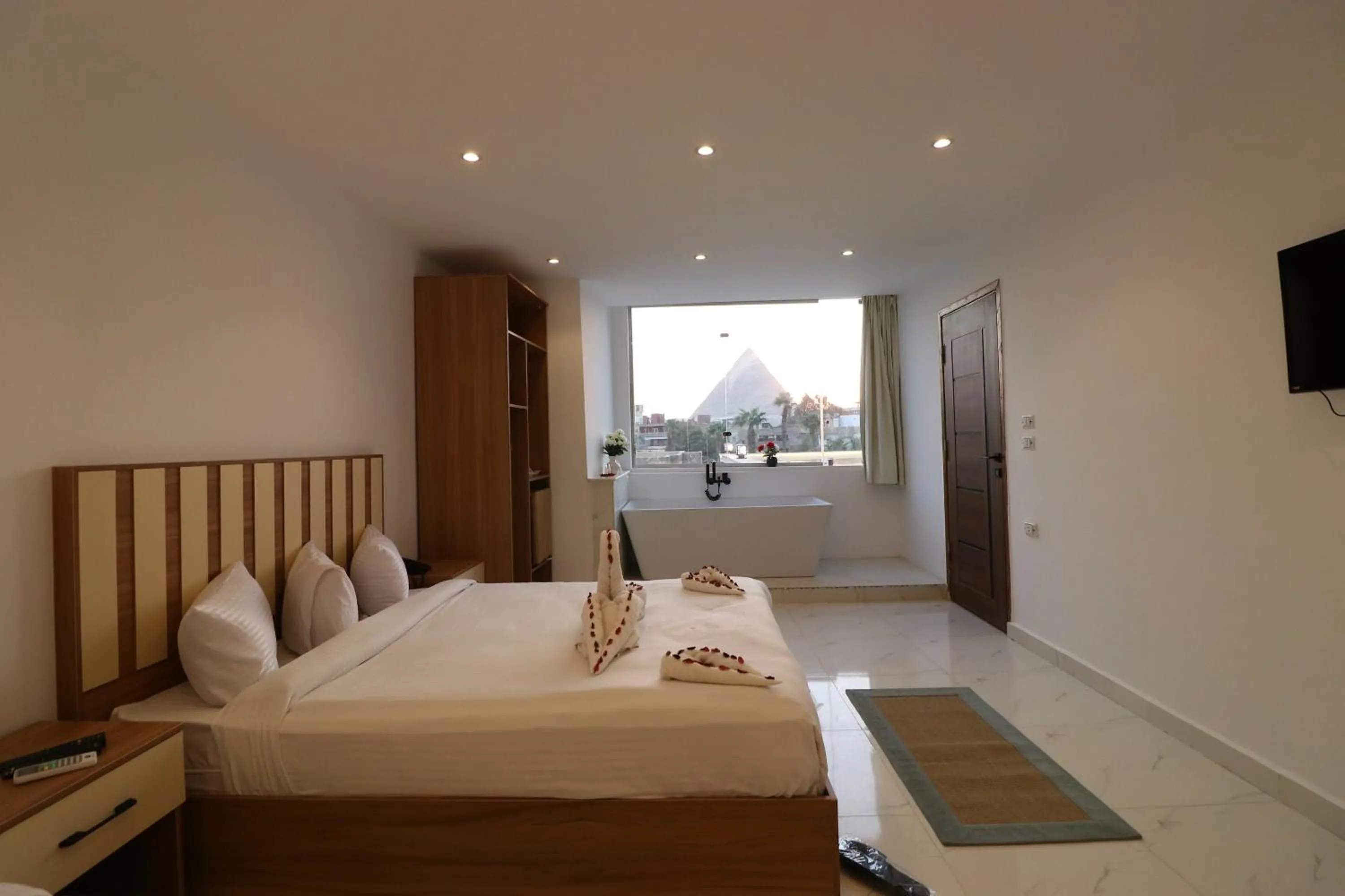 Bed in West Pyramids Hotel