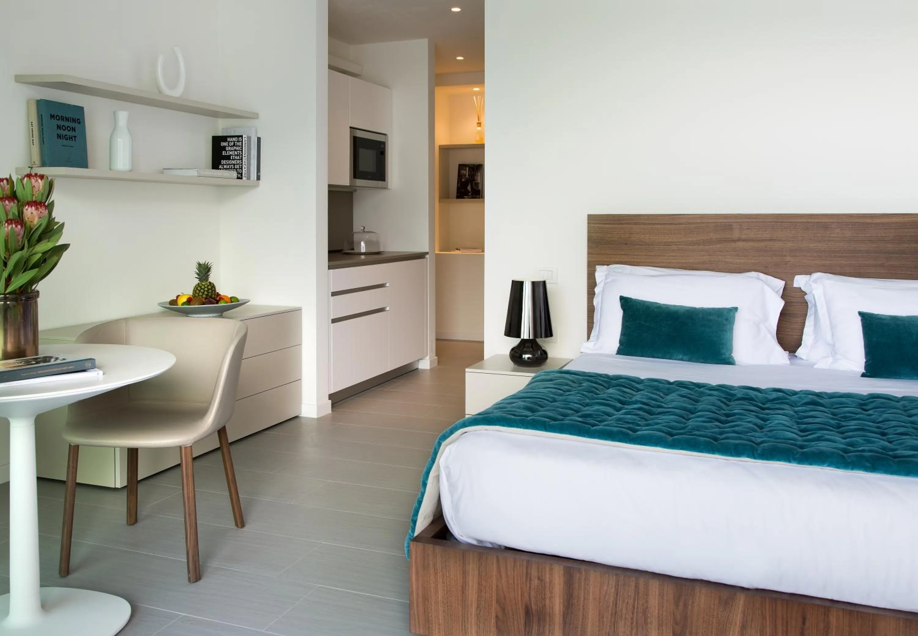 Kitchen or kitchenette, Bed in Filario Hotel & Residences