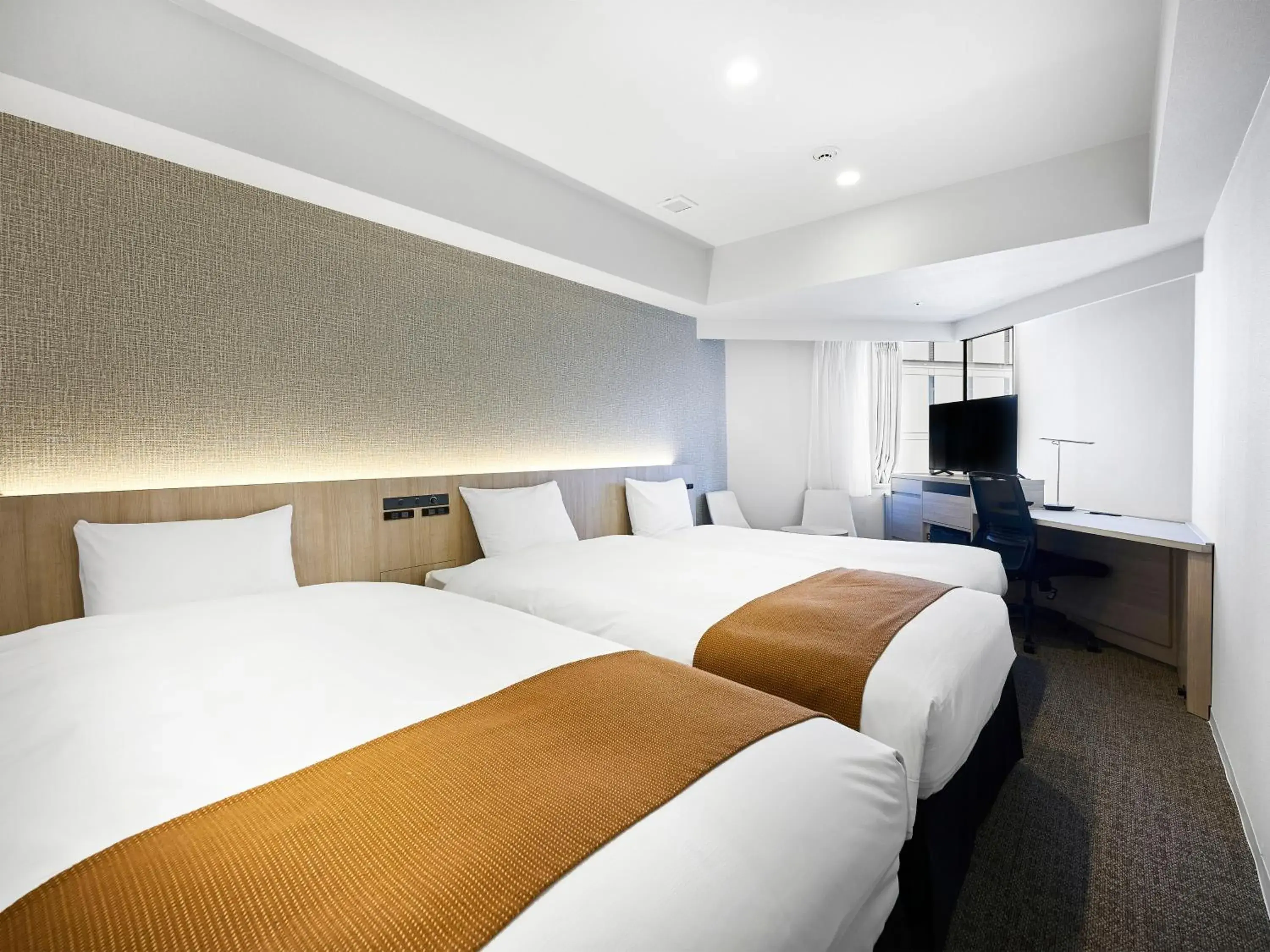 Bed in Daiwa Roynet Hotel Nagoya Shinkansenguchi Bed in Daiwa Roynet Hotel Nagoya Shinkansenguchi