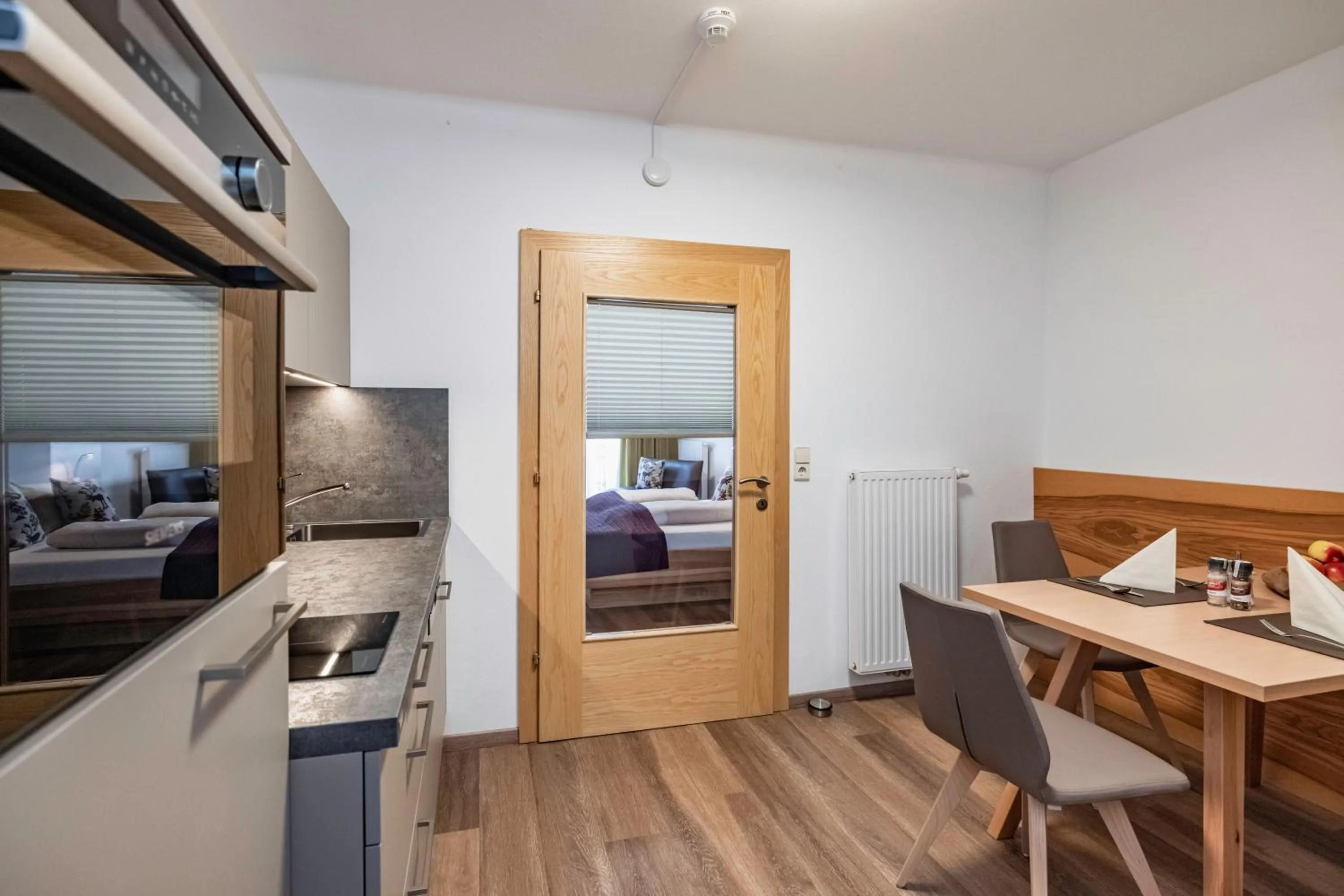 Kitchen or kitchenette, Bed in nawu apartments & Restaurant