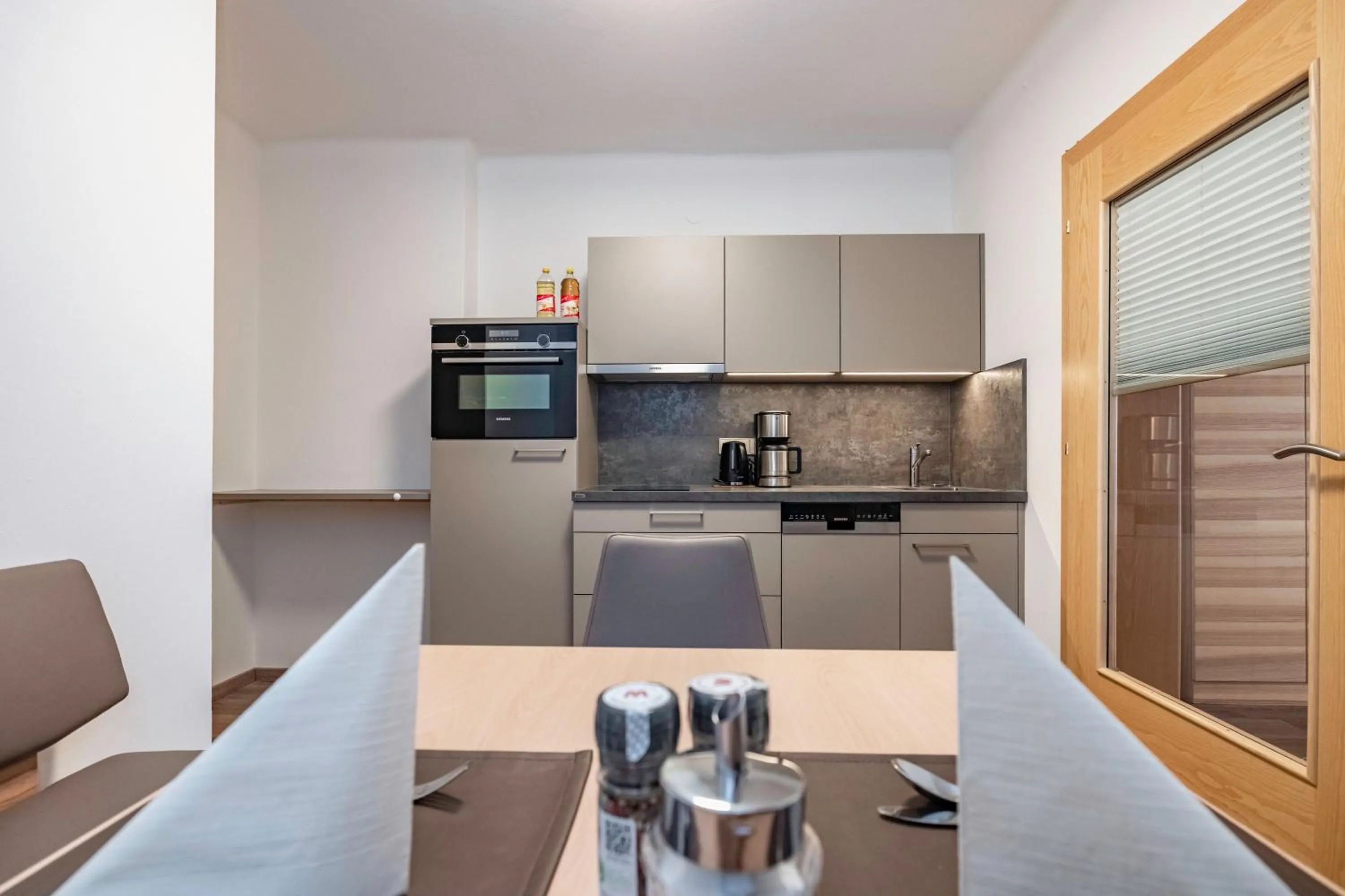 kitchen in nawu apartments & Restaurant