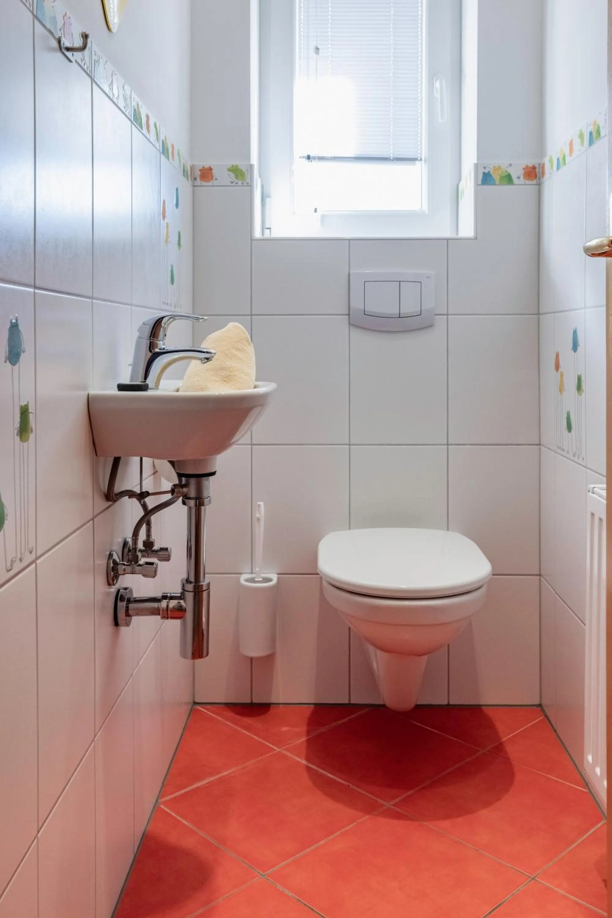 Toilet in nawu apartments & Restaurant