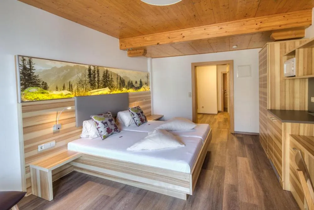 Bed in nawu apartments & Restaurant