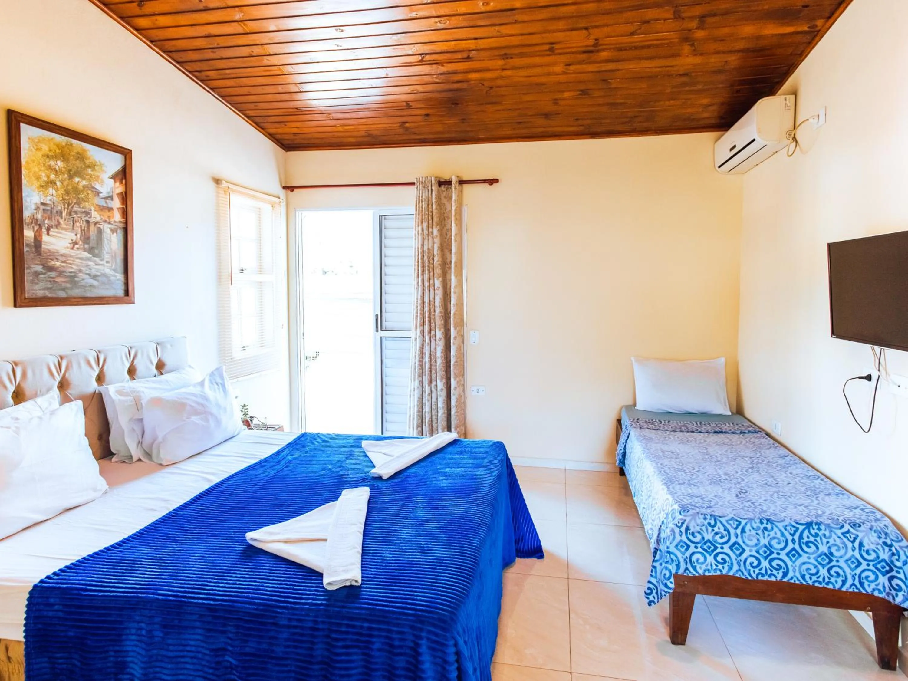 Bed in VELINN Pousada Praia do Perequê