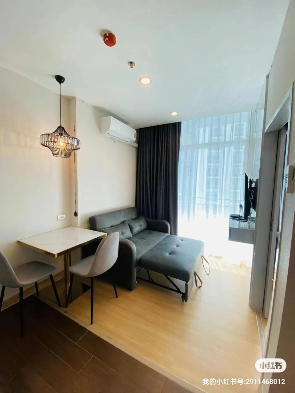 Living room, Bed in The Grand Jomtien Condo