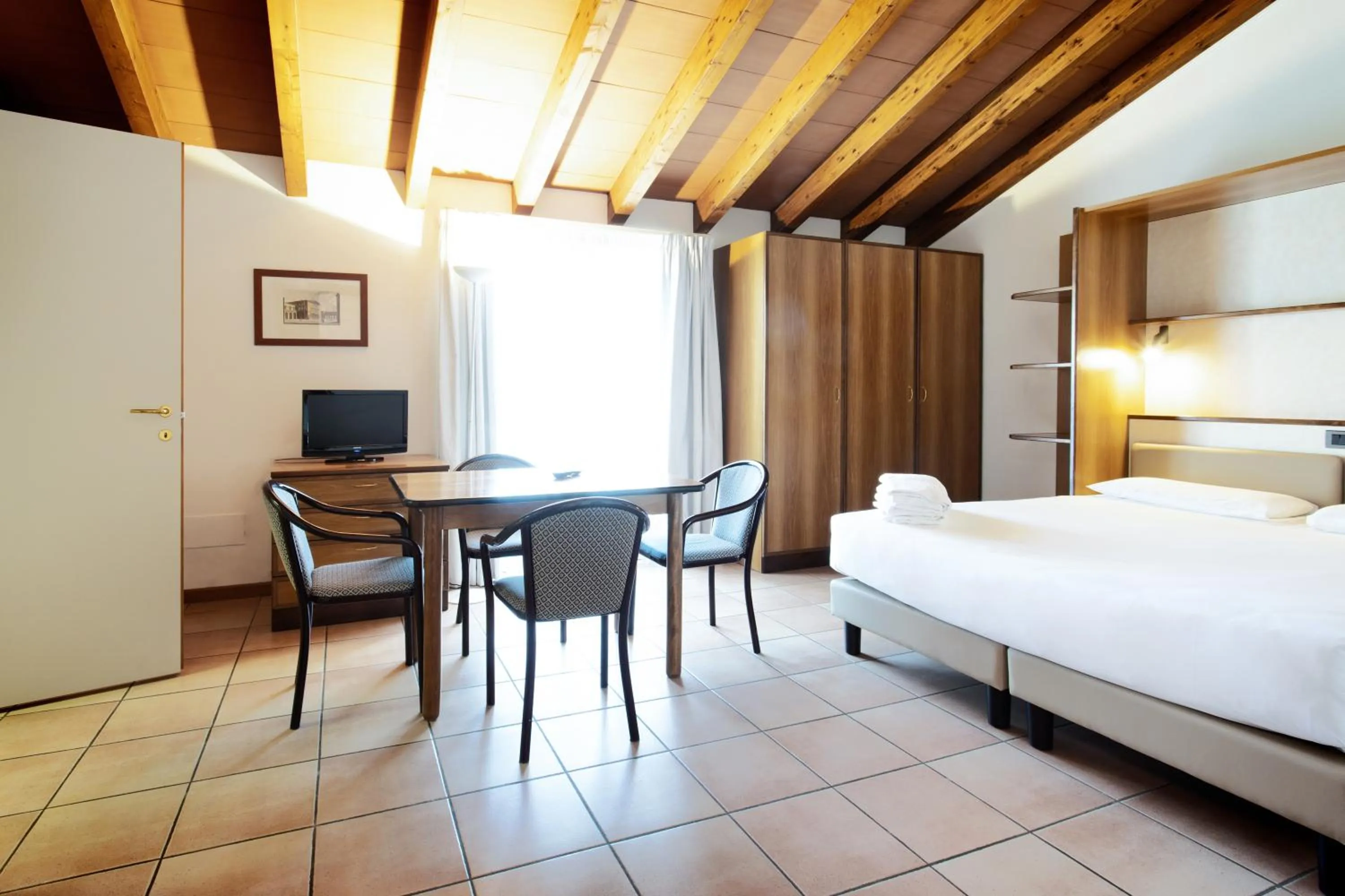 Living room, Bed in Residenza Le Cupole