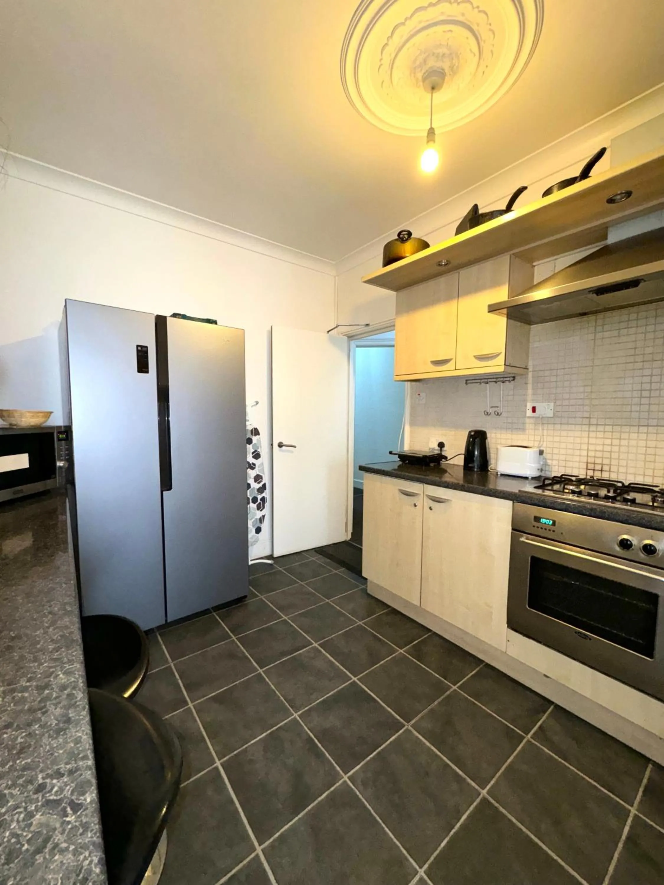 Communal kitchen in Riverside Hotel