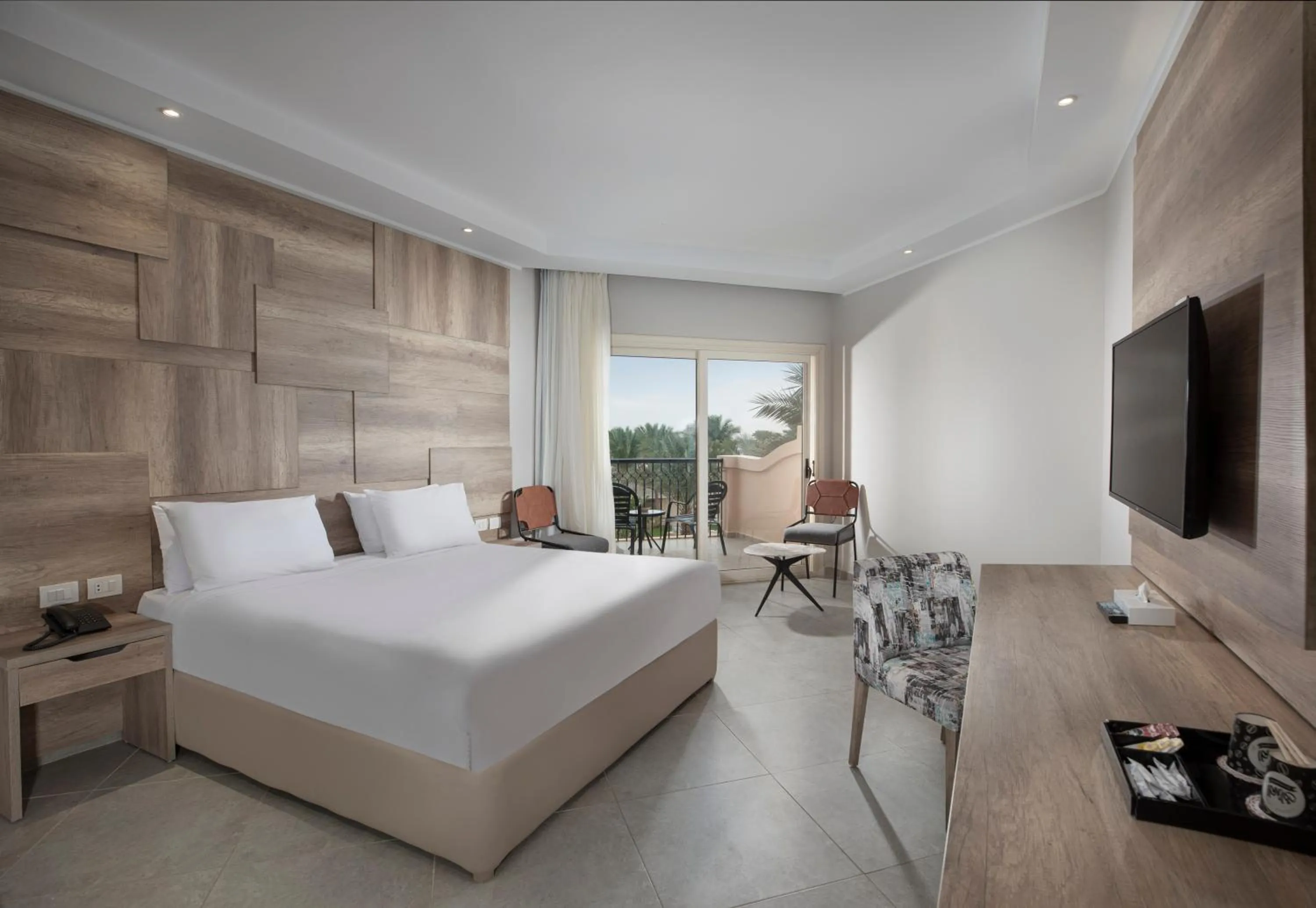 Communal lounge/ TV room, Bed in Pyramisa Beach Resort Sahl Hasheesh